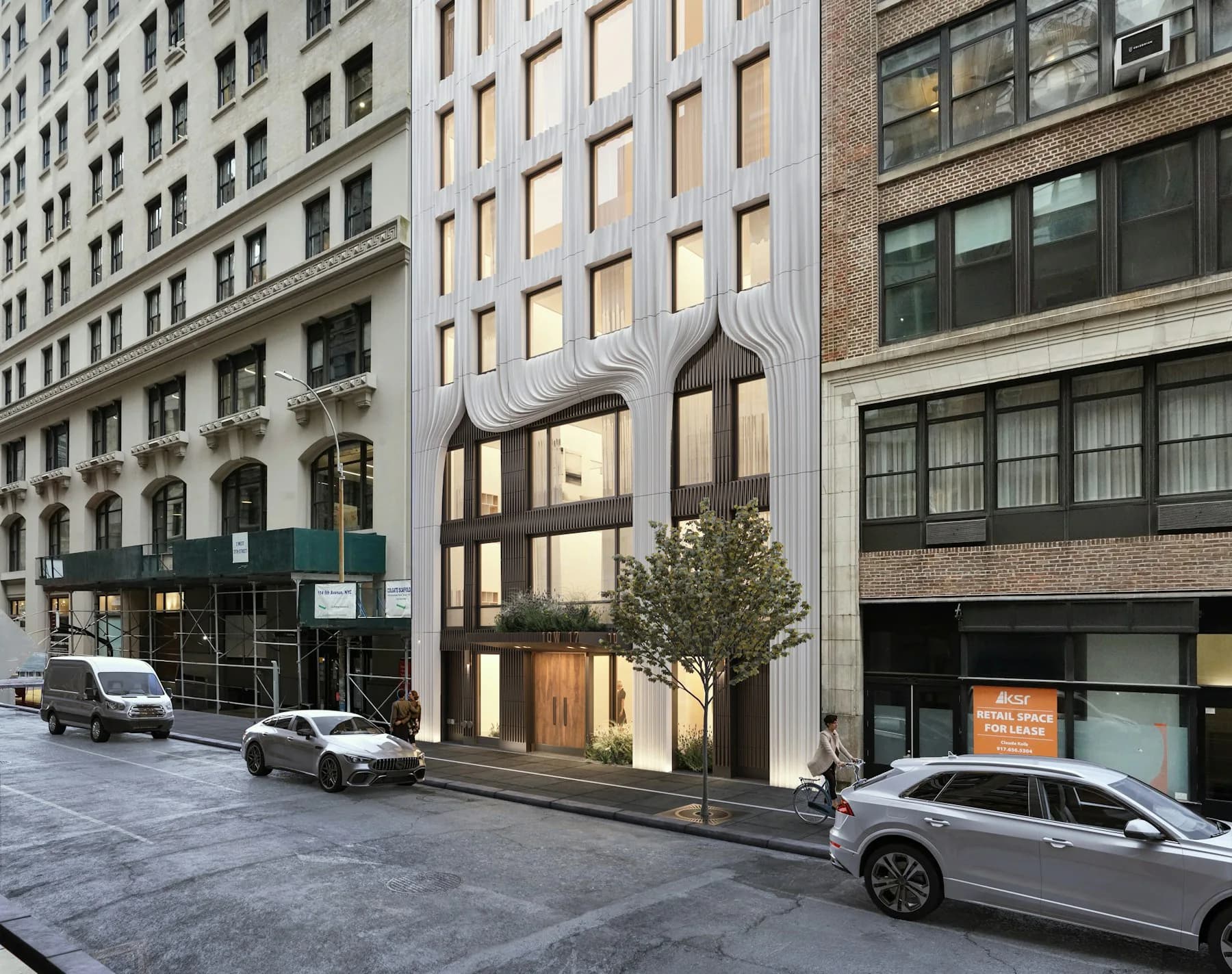 Modern white facade with vertical ribbed detailing and large ground-floor windows, nestled among historic NYC buildings, by Ann Skinner.