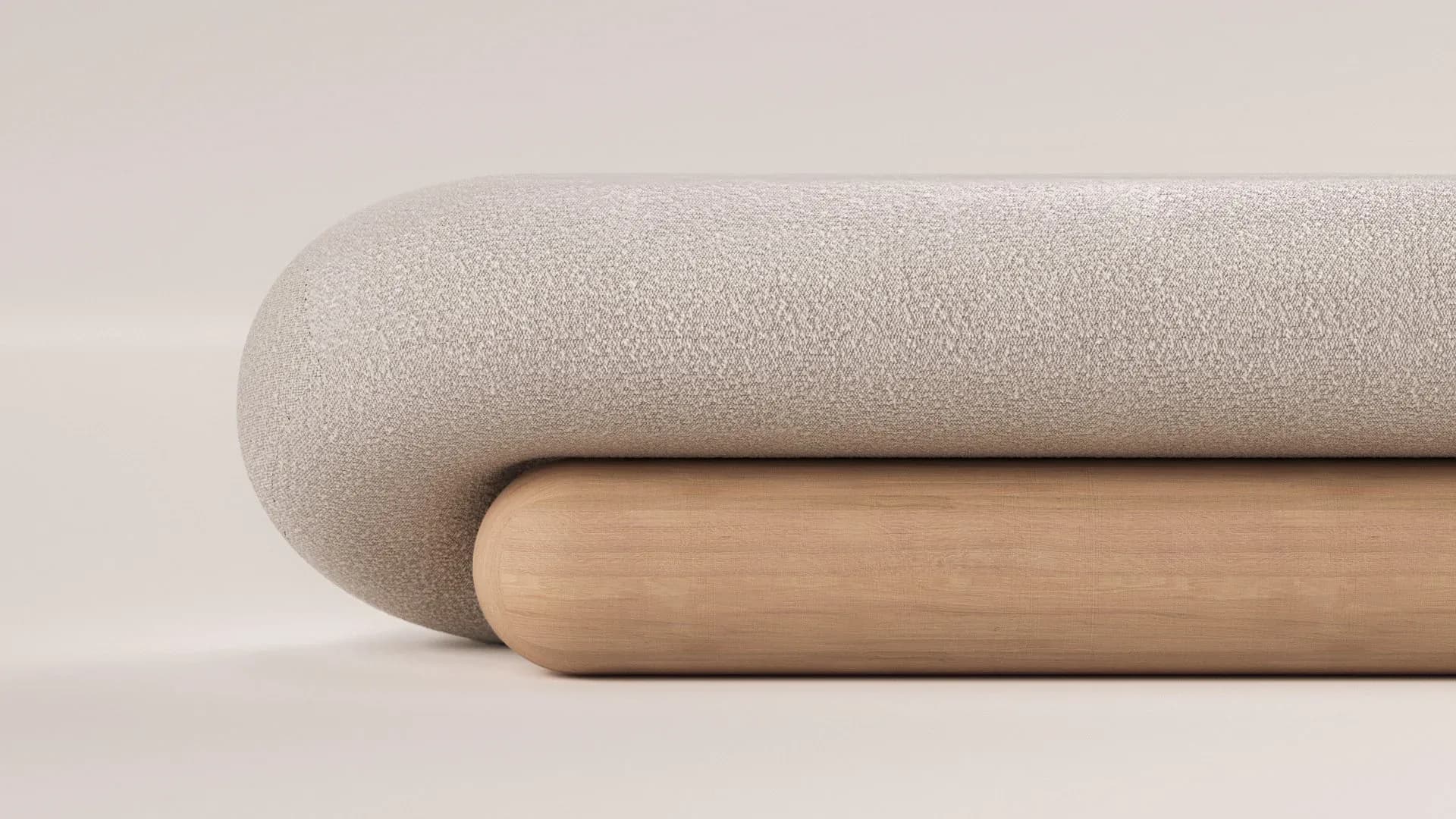 Minimalist furniture detail showing a rounded beige upholstered form resting on a natural wood cylindrical base by Arthur Vallin.