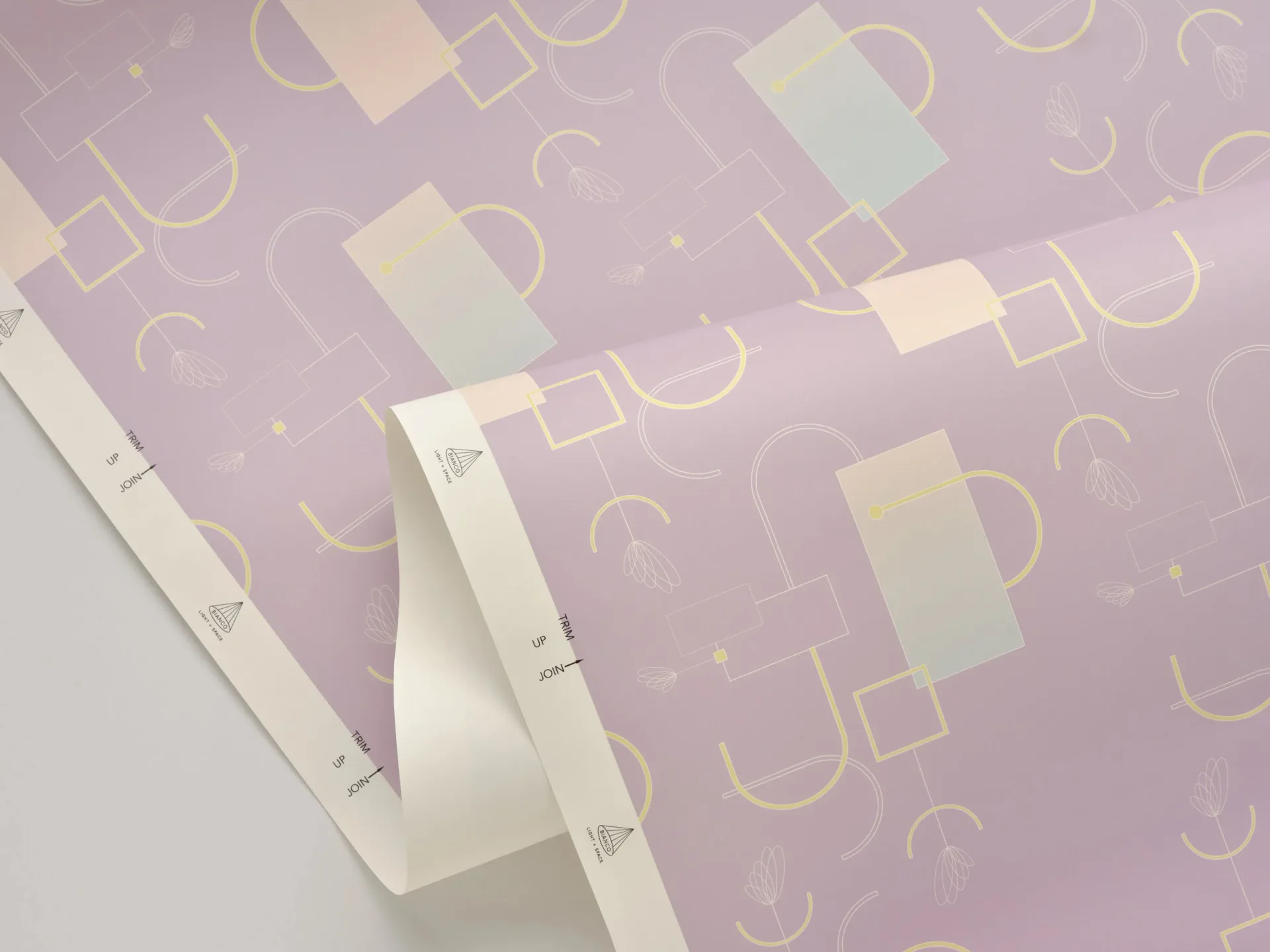 Fabric or wallpaper swatch featuring geometric shapes and curved lines in cream and gold tones on lavender background by Bianco Light + Space.