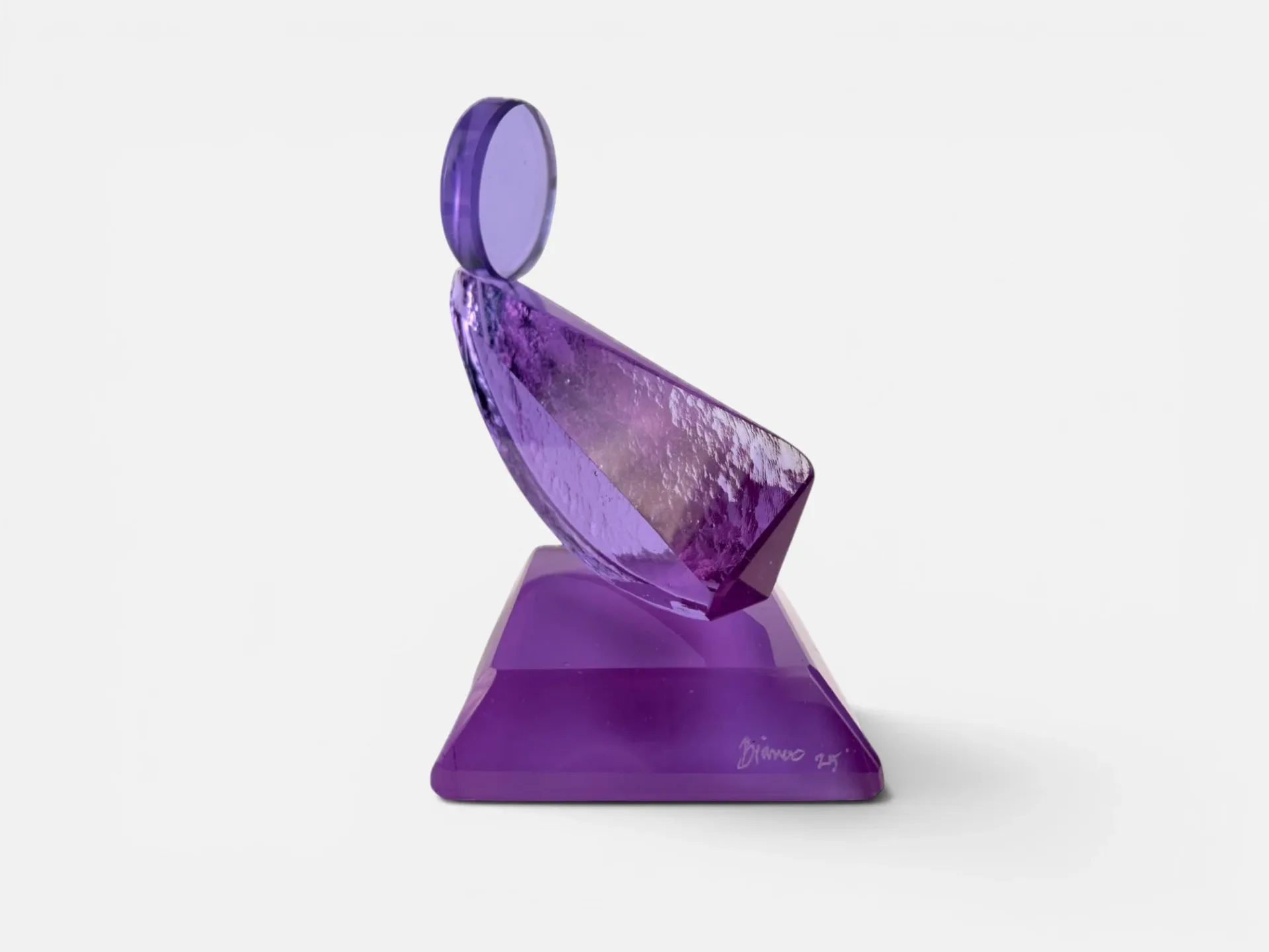 Purple translucent sculptural art glass object with geometric forms balanced on a solid purple base, by Bianco Light + Space.