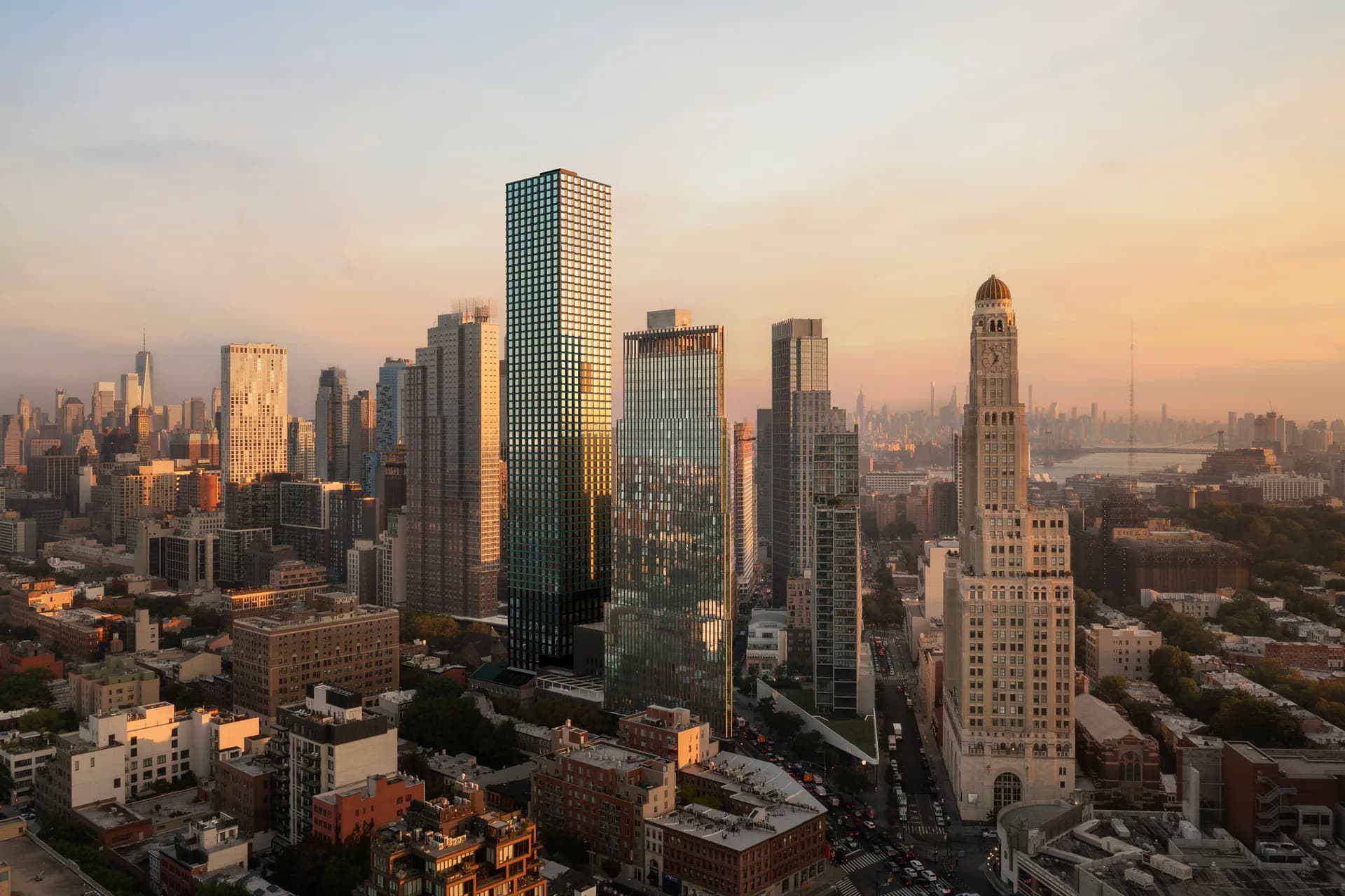 Manhattan skyline at golden hour featuring iconic skyscrapers and architectural landmarks bathed in warm sunlight, photographed by Brandon Lim.