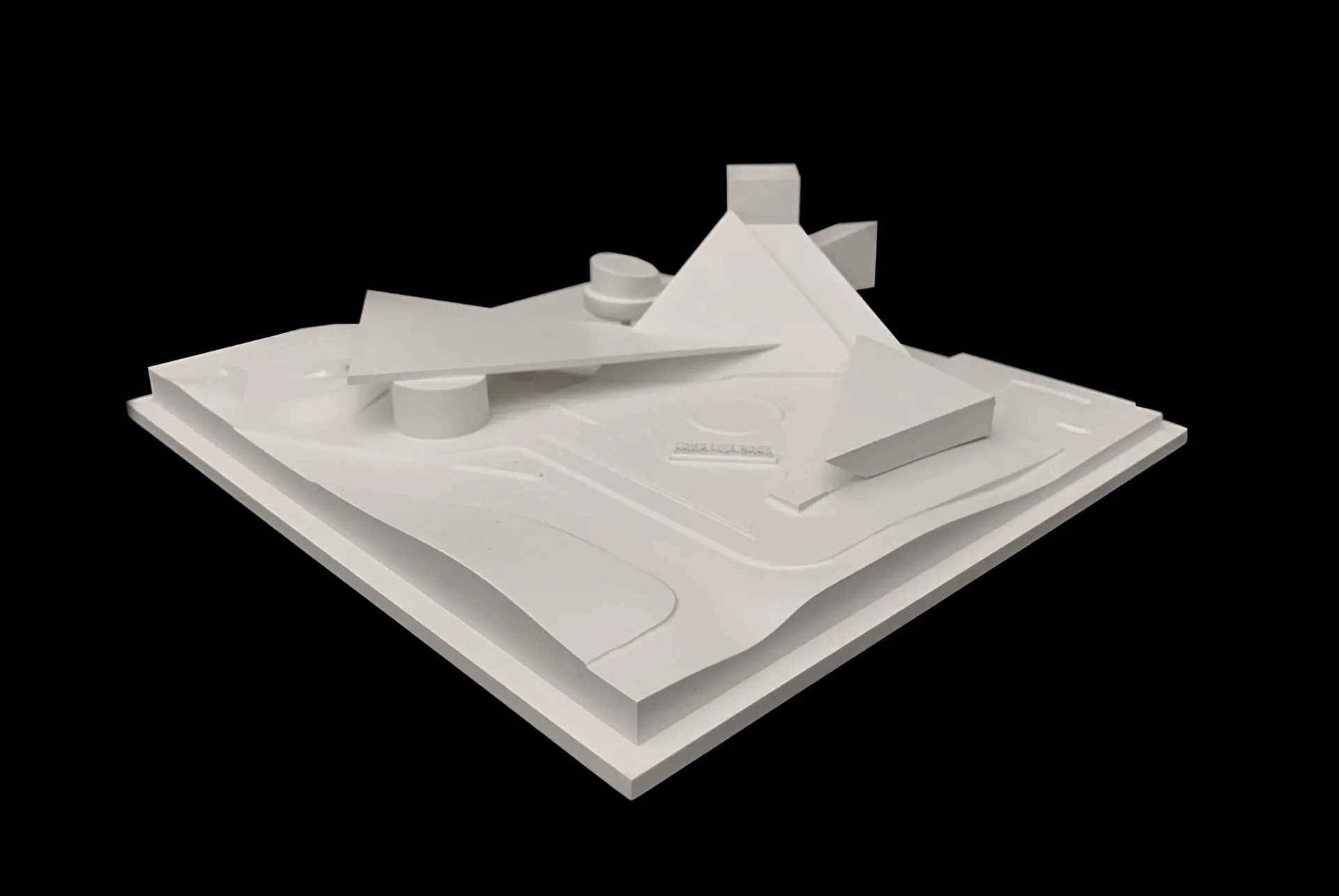 White architectural model on a base plate featuring abstracted geometric forms and sculptural elements, by Bryan Dorsey.