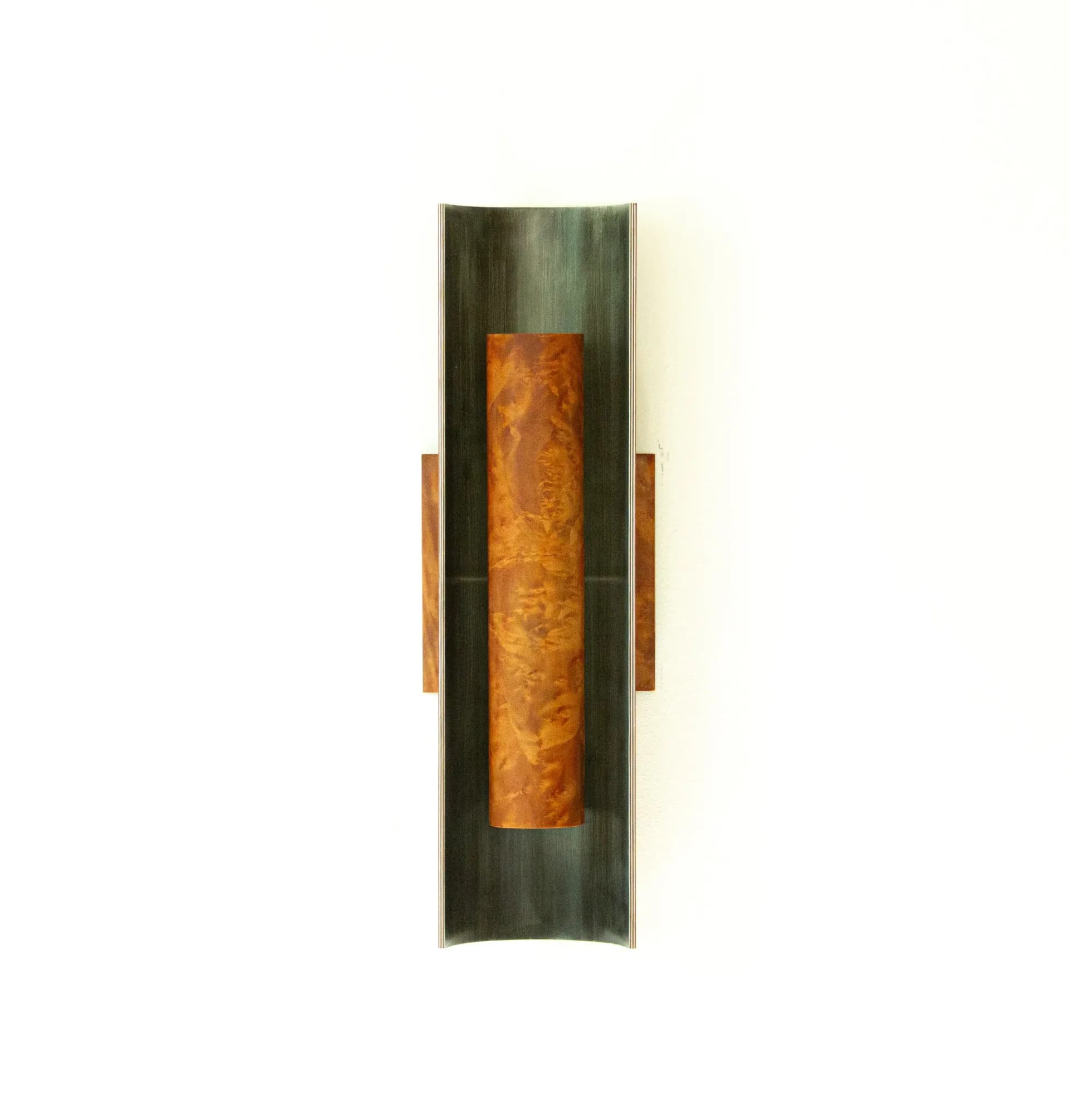 Vertical wall sconce with dark green metal backing, central amber-toned cylinder, and small bronze-finish side handles by Charles Grantham.