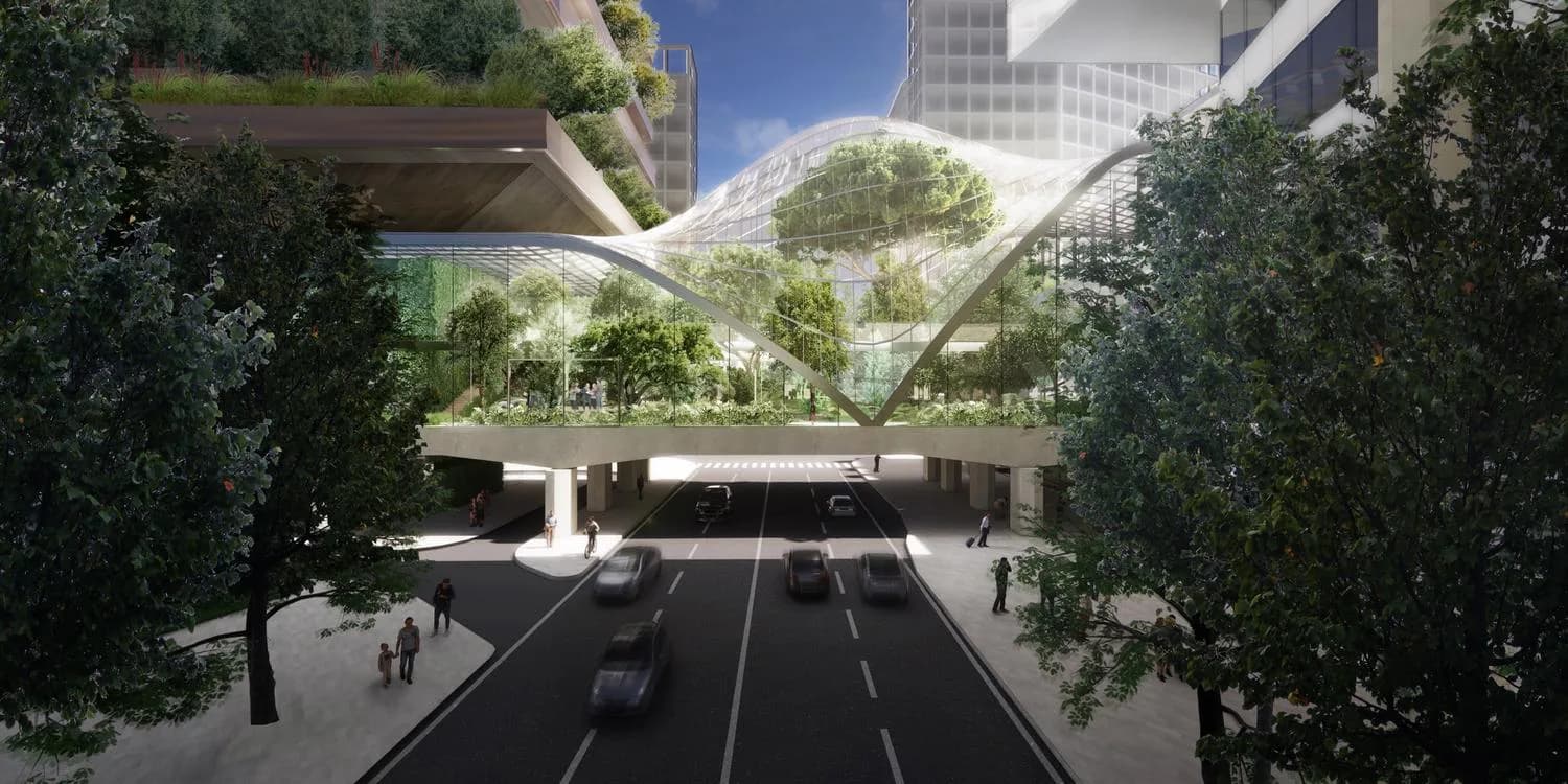 Architectural rendering of an elevated green plaza with curved structural elements, pedestrian pathways, and integrated vegetation framing a street view below, designed by Charles Renfro.