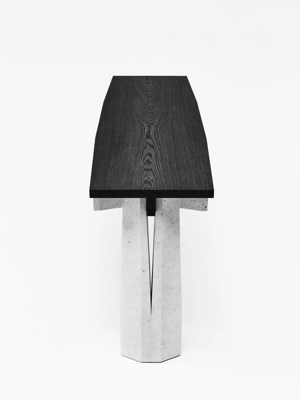 Minimalist table lamp with a dark wood-grain textured shade and cylindrical concrete base, photographed against a white background by Christophe Delcourt.