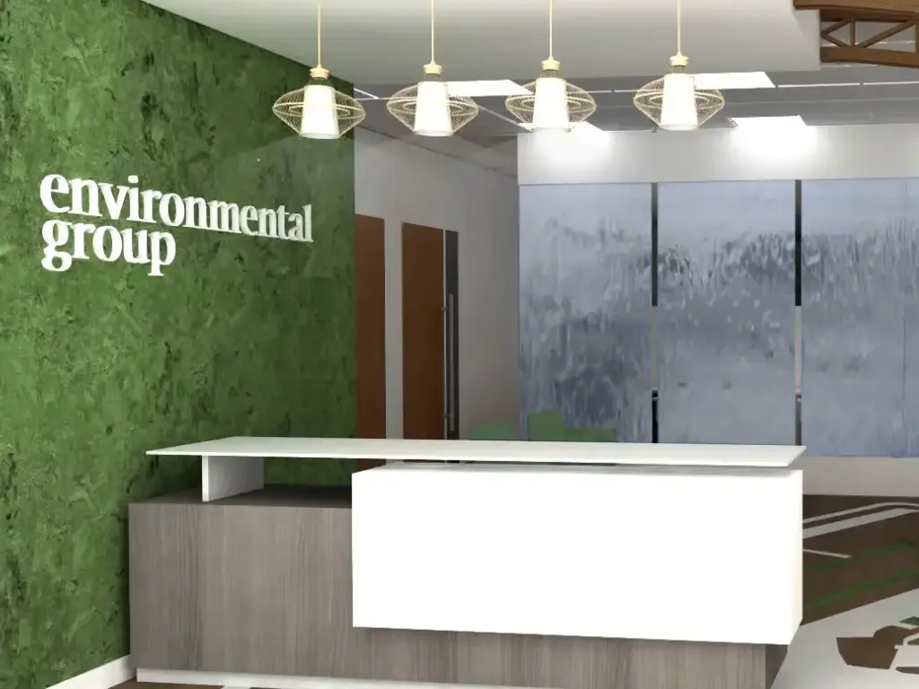 Modern office reception area with green textured accent wall, white desk, pendant lighting, and forest-themed window graphics by Edelyn De La Cruz.