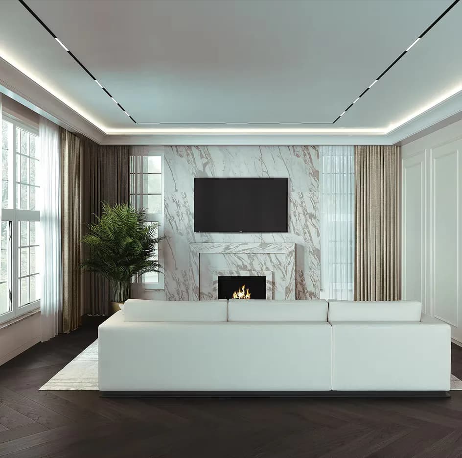 Modern living room with white sectional sofa, marble fireplace accent wall, wall-mounted TV, and linear ceiling lighting by Elena Nesterova.