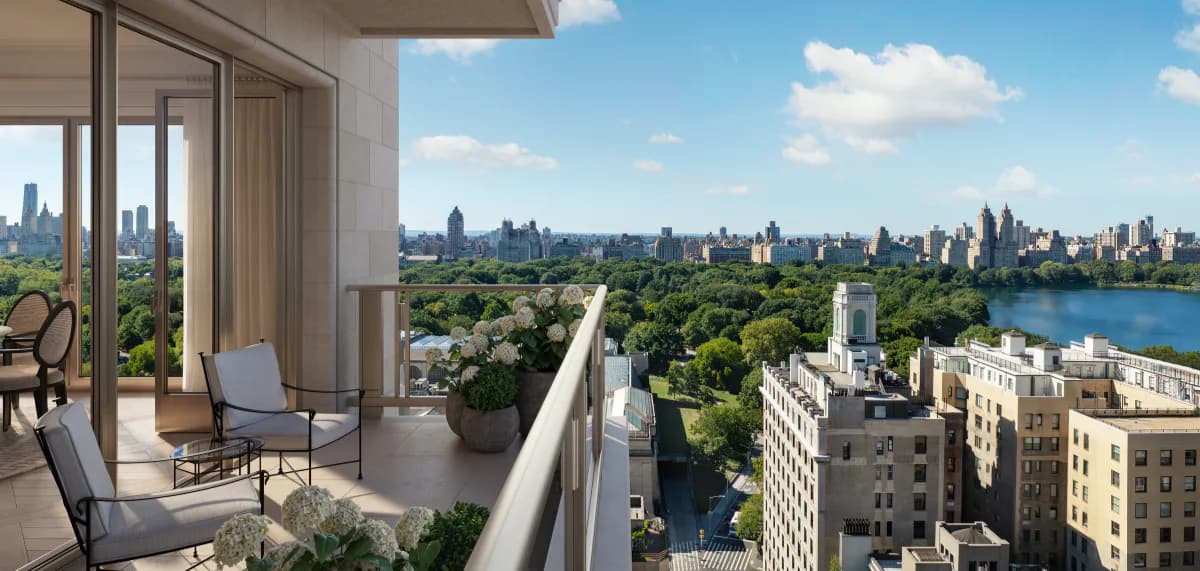High-rise residential balcony overlooking Central Park and Manhattan skyline with contemporary furnishings and floor-to-ceiling windows by Ellen Oh.