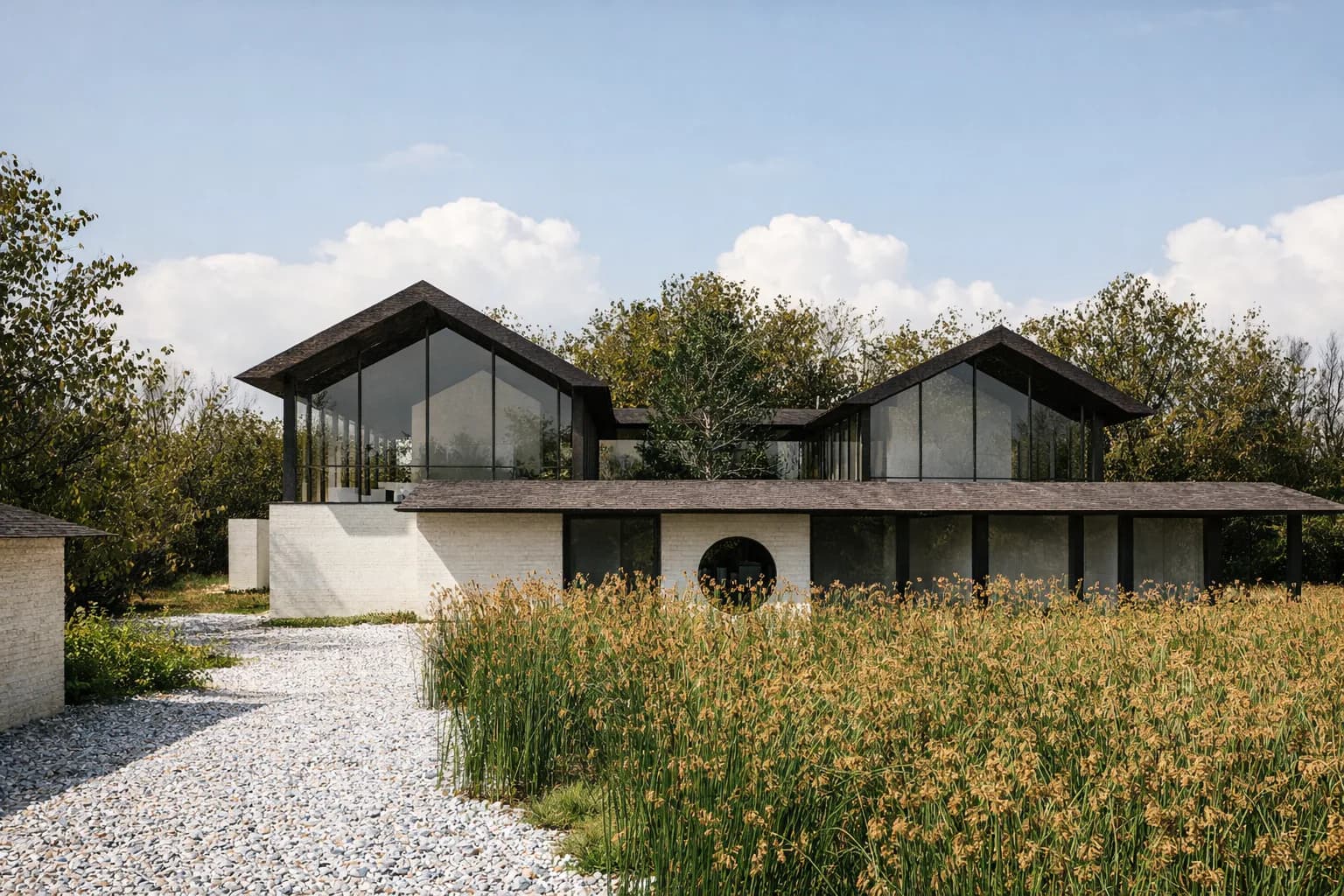Modern residential architecture featuring pitched-roof pavilions with dark frames and white concrete bases overlooking a wildflower meadow by Erika Stahlman.