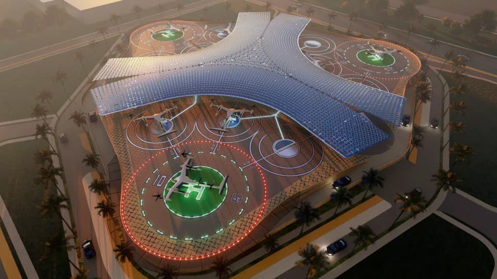 Overhead architectural rendering of an ornate circular venue interior with red patterned floors, blue curved ceiling elements, and green circular features by Gregg Pasquarelli.