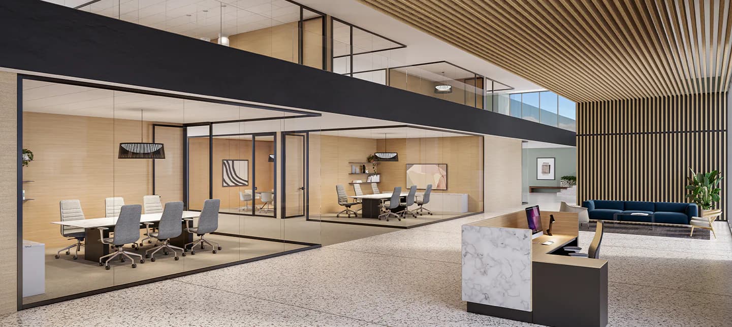 Modern office interior with glass-walled conference room, cream and black finishes, polished flooring, and minimalist reception desk by Heather Raho.