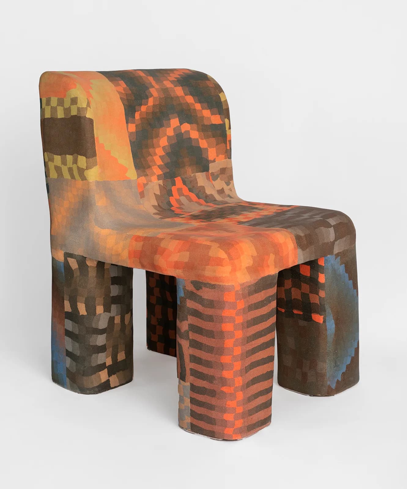 Pixelated blocky chair with orange, brown, and gray tones resembling Minecraft-style voxel art by Isabel Rower.