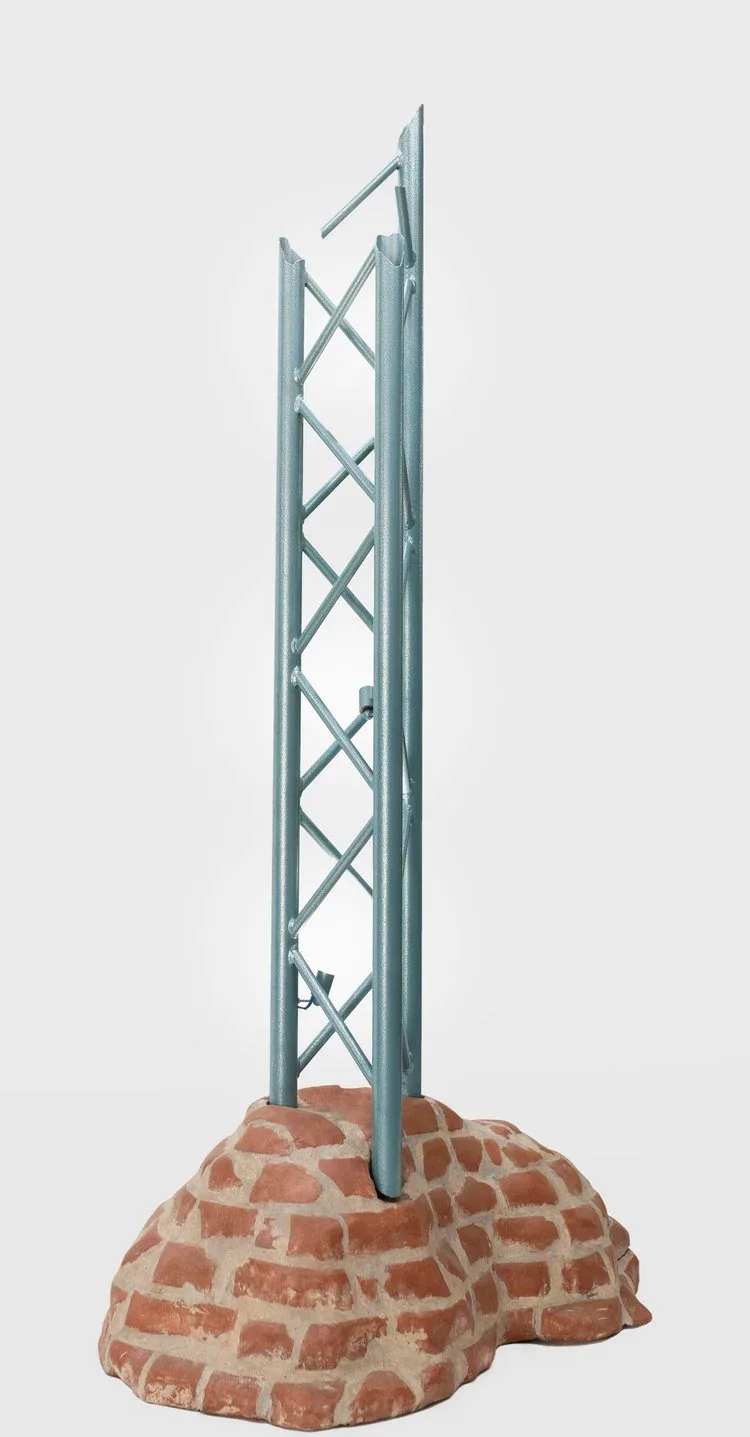 Tall steel lattice tower structure with cross-bracing mounted on a brick base, architectural concept by Jack Eriksson.