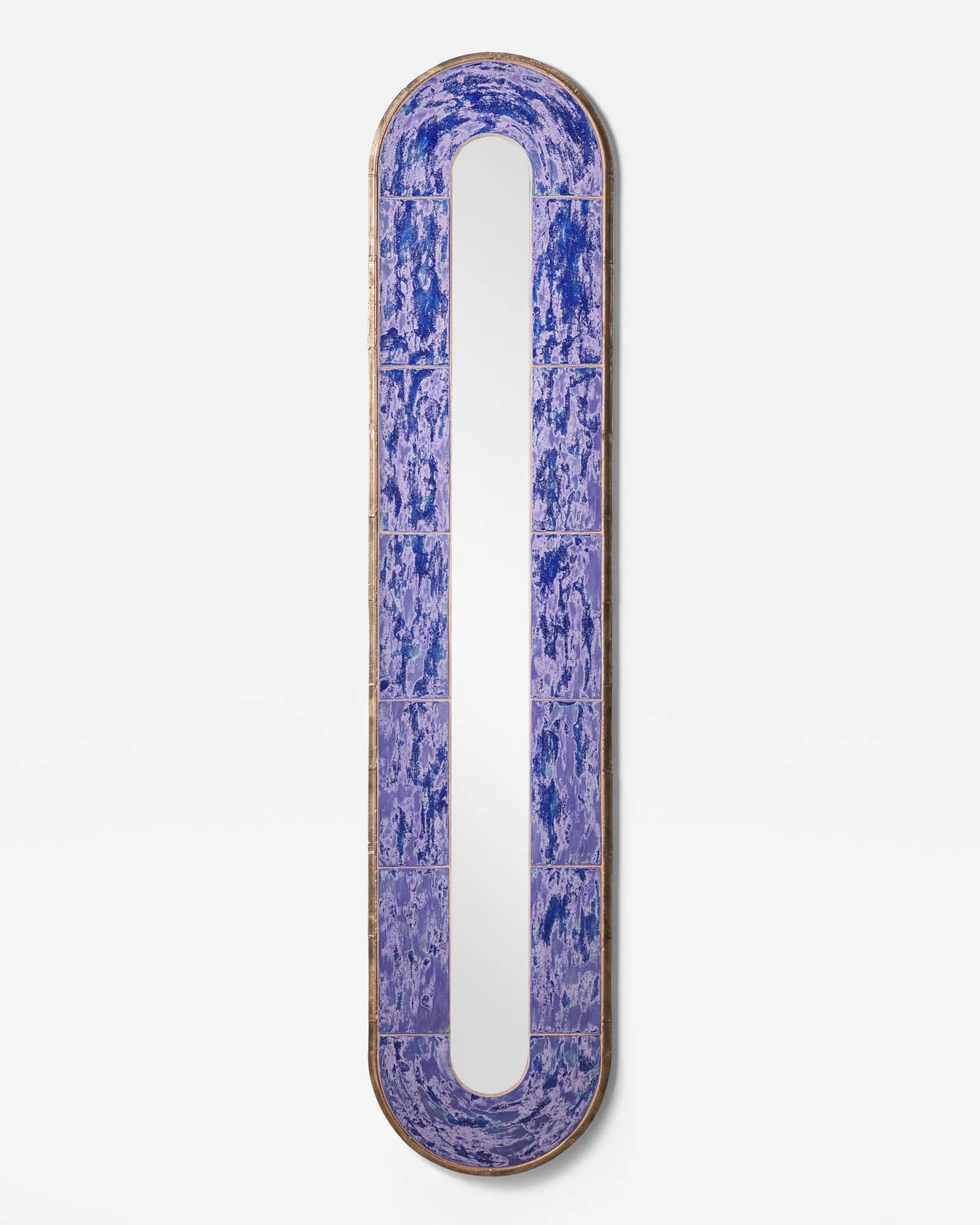 Elongated sculptural object with rounded ends in deep blue and purple glazed ceramic with metallic gold rim detailing by Jeremy Anderson.