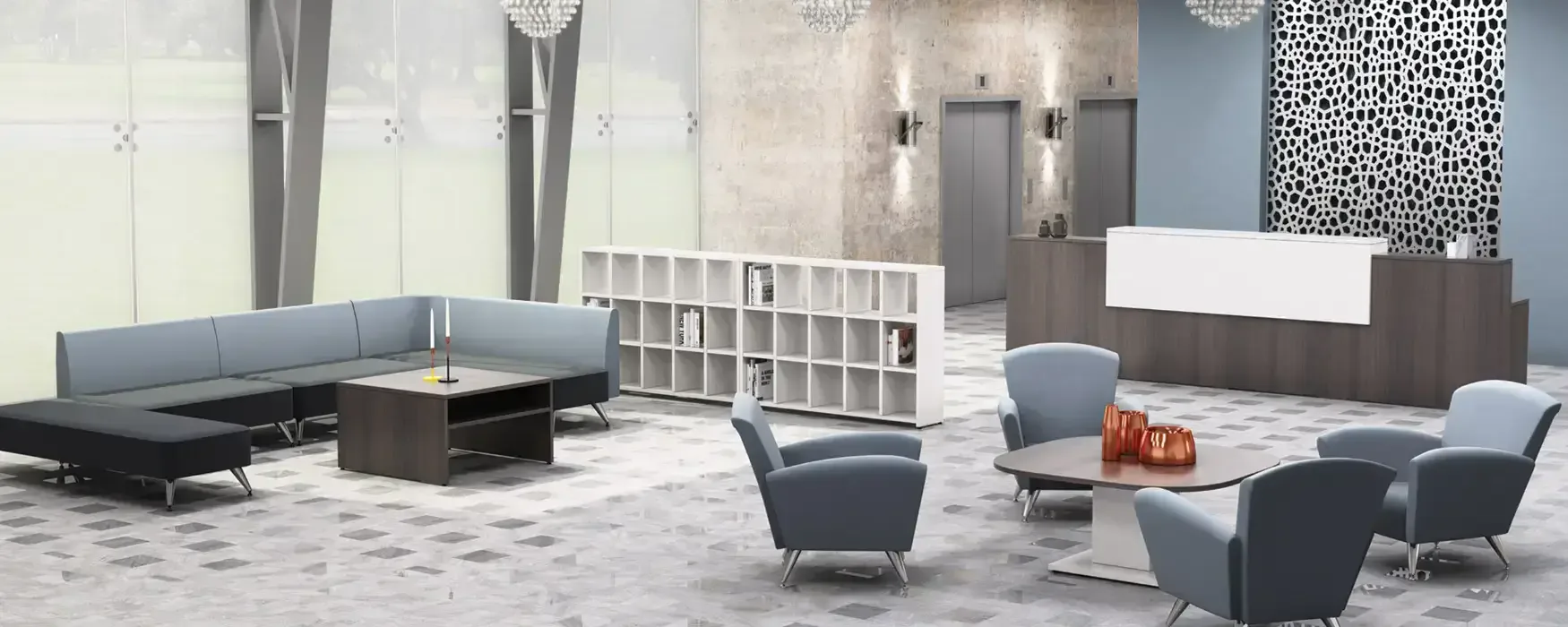 Modern office lounge with gray upholstered seating, black tables, white shelving unit, and patterned accent wall designed by Jerry Rock.