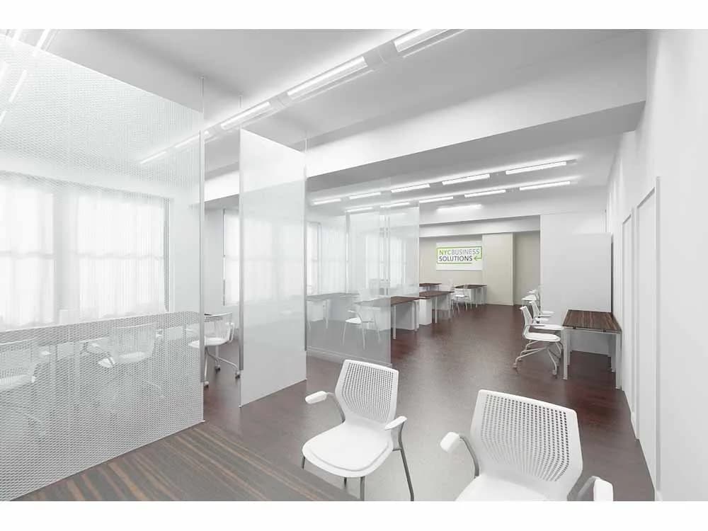 Modern office interior with glass partitions, white chairs, and dark wood flooring, designed by Karen Lee.