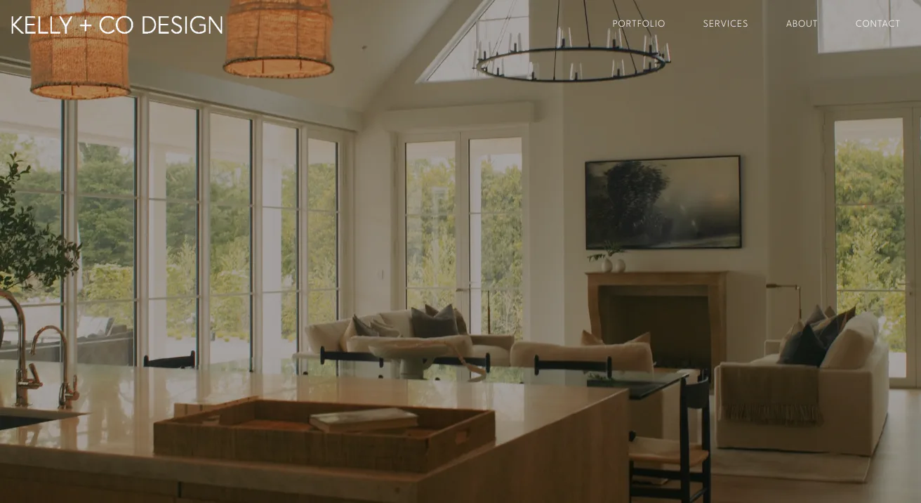 Open-concept living space with glass doors, neutral palette, and modern furnishings by Kelly Mittleman.