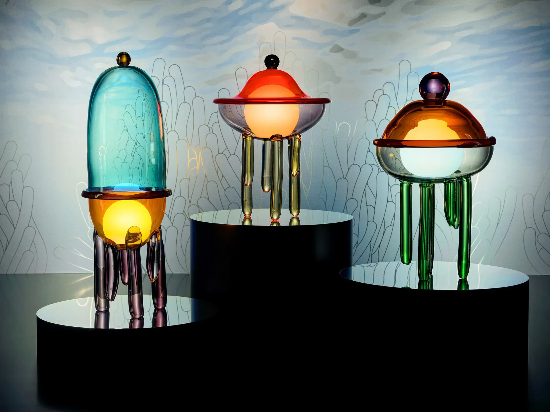 Three luminous sculptural vessels with glowing orbs and dripping metallic elements arranged on black pedestals against a sketched backdrop, by Kickie Chudikova.
