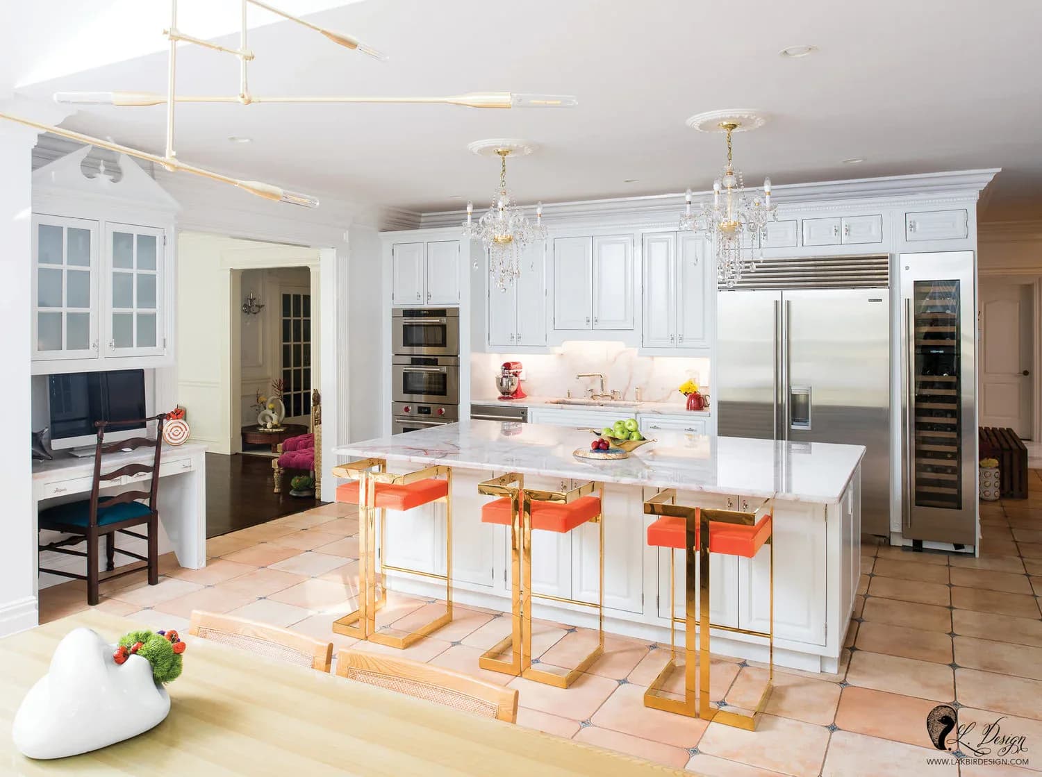 Bright, modern kitchen with white cabinetry, white marble island with orange bar stools, stainless steel appliances, pendant lighting, and open-concept layout by Lakbir Mahajan.