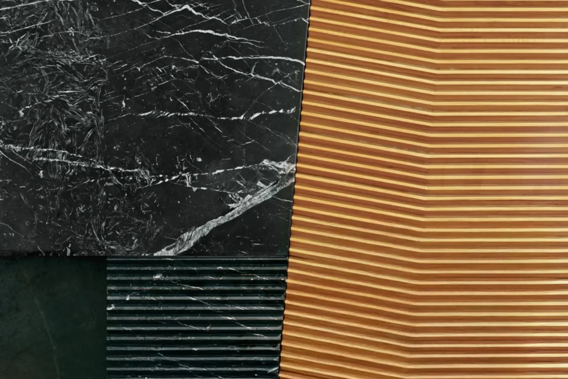Abstract material composition featuring four textured panels: black marble with white veining, tan horizontal ribbed surface, deep green horizontal slats, and warm terracotta ribbed texture, showcasing design exploration by Lisa Dang.