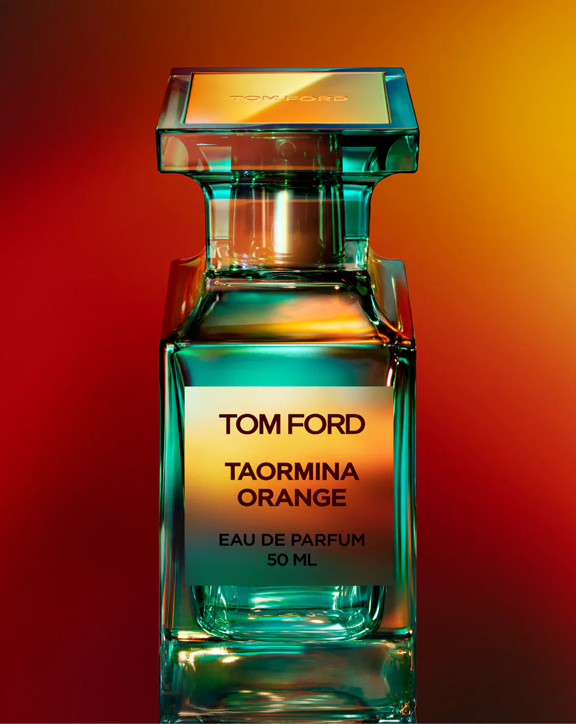 Tom Ford Taormina Orange perfume bottle photographed against warm gradient background, showcasing product design and professional lighting by Lisa Sumner.
