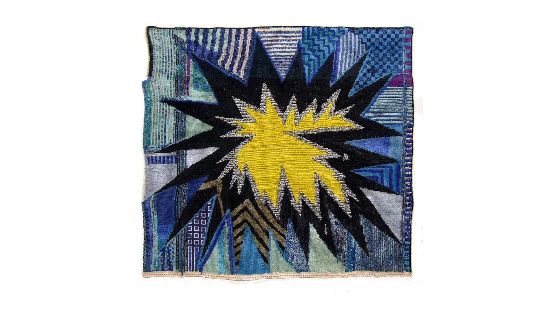Vibrant textile design featuring a yellow starburst with black rays radiating outward, surrounded by blue geometric patterns and striped elements by Liz Collins.