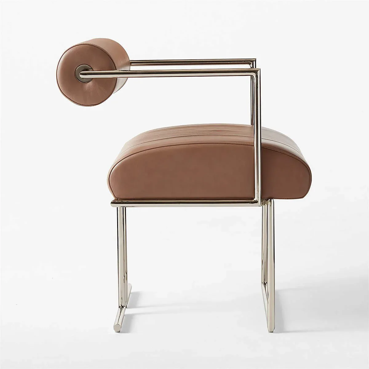 Contemporary chair with curved brown upholstered seat and backrest on metal frame with brown circular headrest element by Luam Melake.
