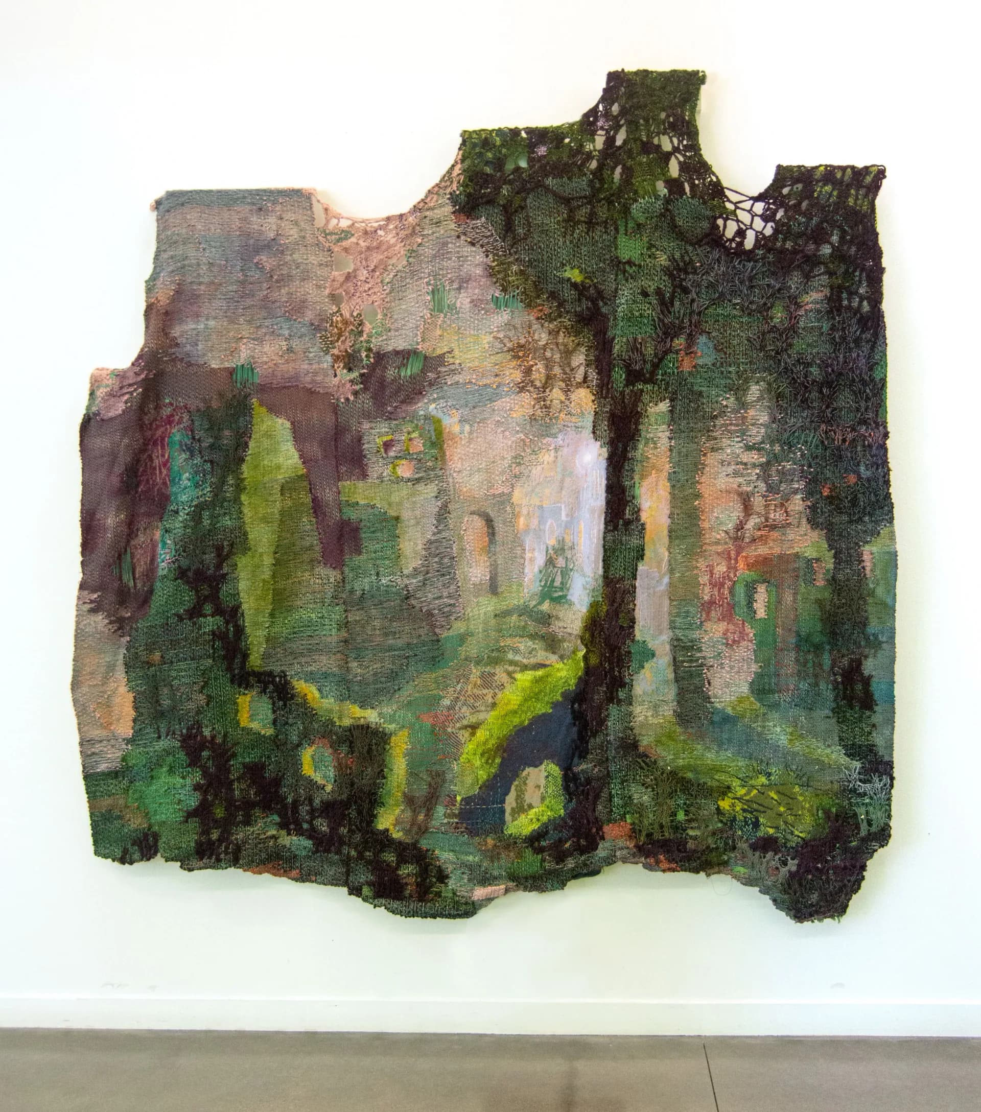 Moss-covered architectural ruin with weathered brick walls and verdant green growth, showcasing organic material transformation by Maris Van Vlack.
