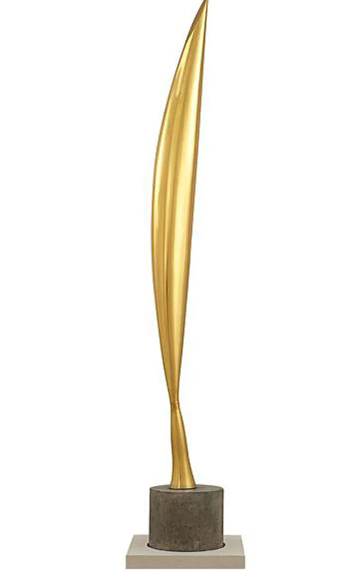 Tall sculptural art piece with elongated golden brass form on concrete and stone base by Mark Rosenhaus.