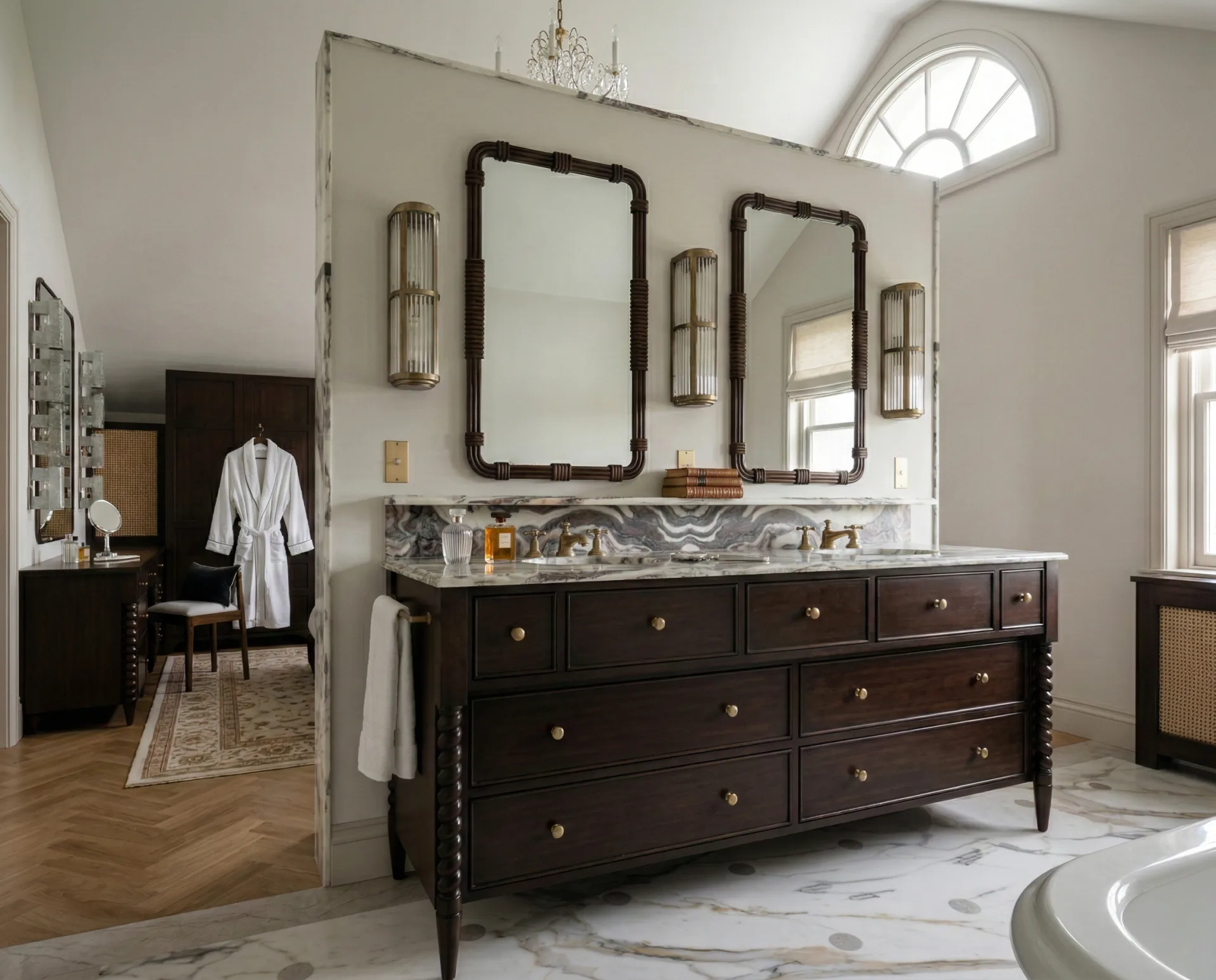 Luxurious bathroom with dark wood double vanity, marble countertops, arched mirrors, brass sconces, and marble flooring by Michael Gilbride.