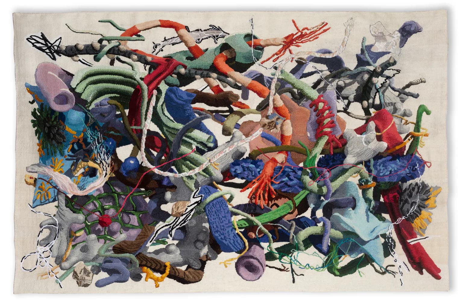 Colorful abstract sculptural installation featuring layered paper and fabric forms in vibrant blues, reds, greens, and purples by Misha Kahn.