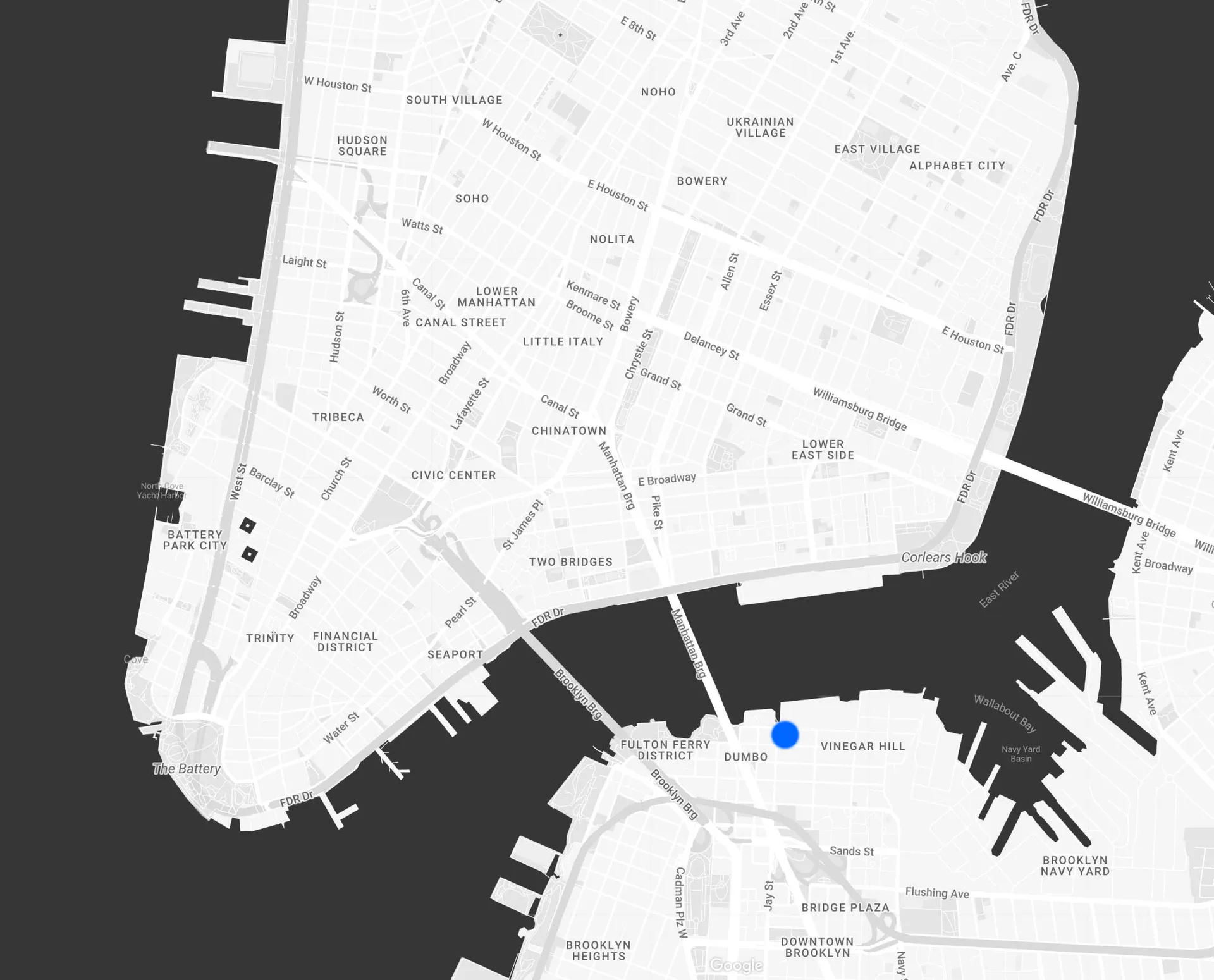 Site plan of lower Manhattan waterfront showing street layout, building footprints, and waterfront features with a blue location marker by Natalia Landowska.