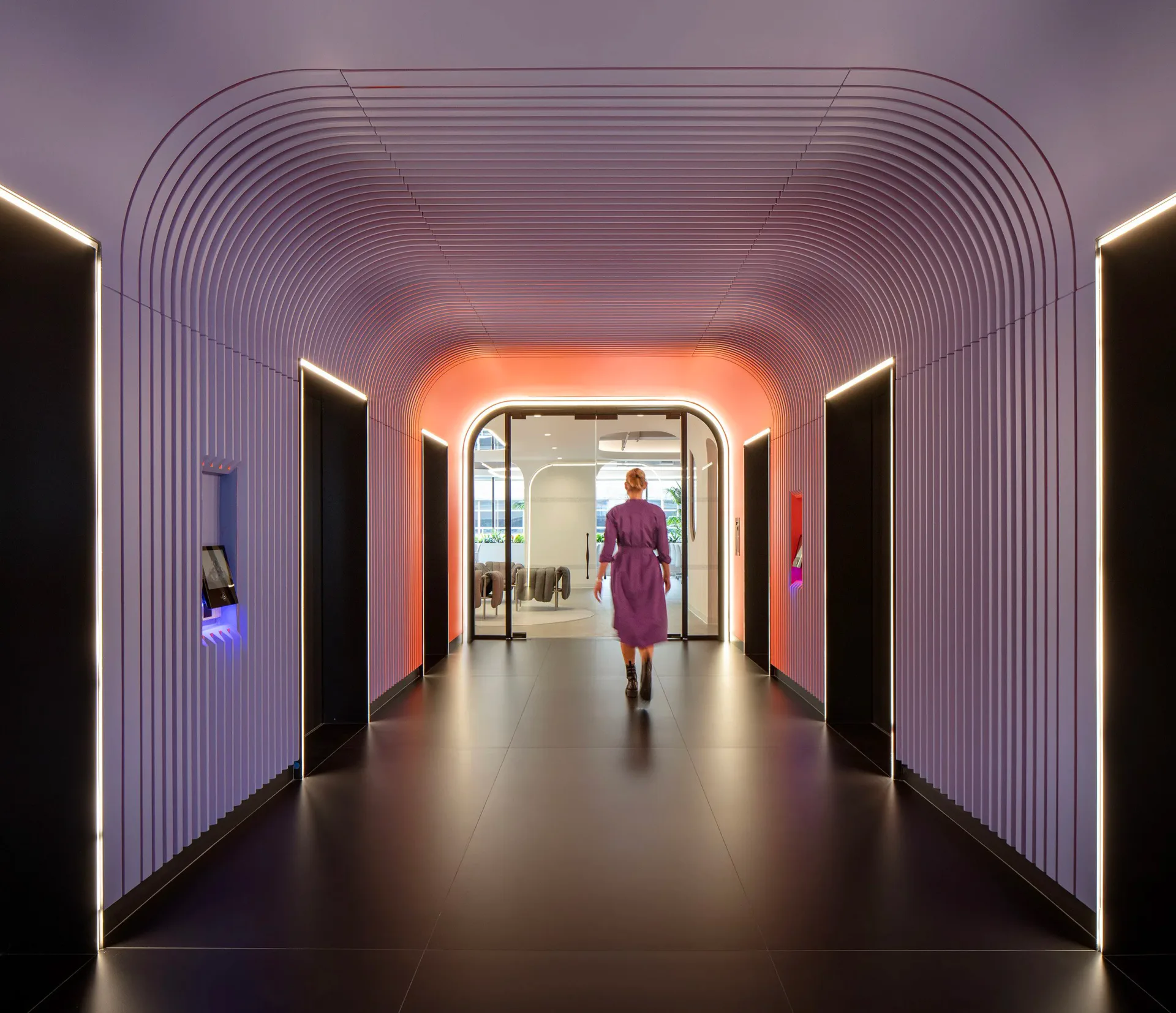 Modern corridor with purple ribbed wall panels, orange neon accent lighting, and polished dark flooring, designed by Nicolas Martin.