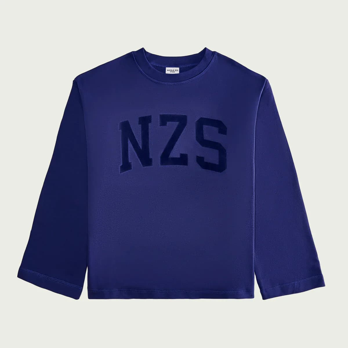 Navy blue crewneck sweatshirt with embroidered 'NZS' lettering on the chest, showcasing branding work by Nicole Zizi.