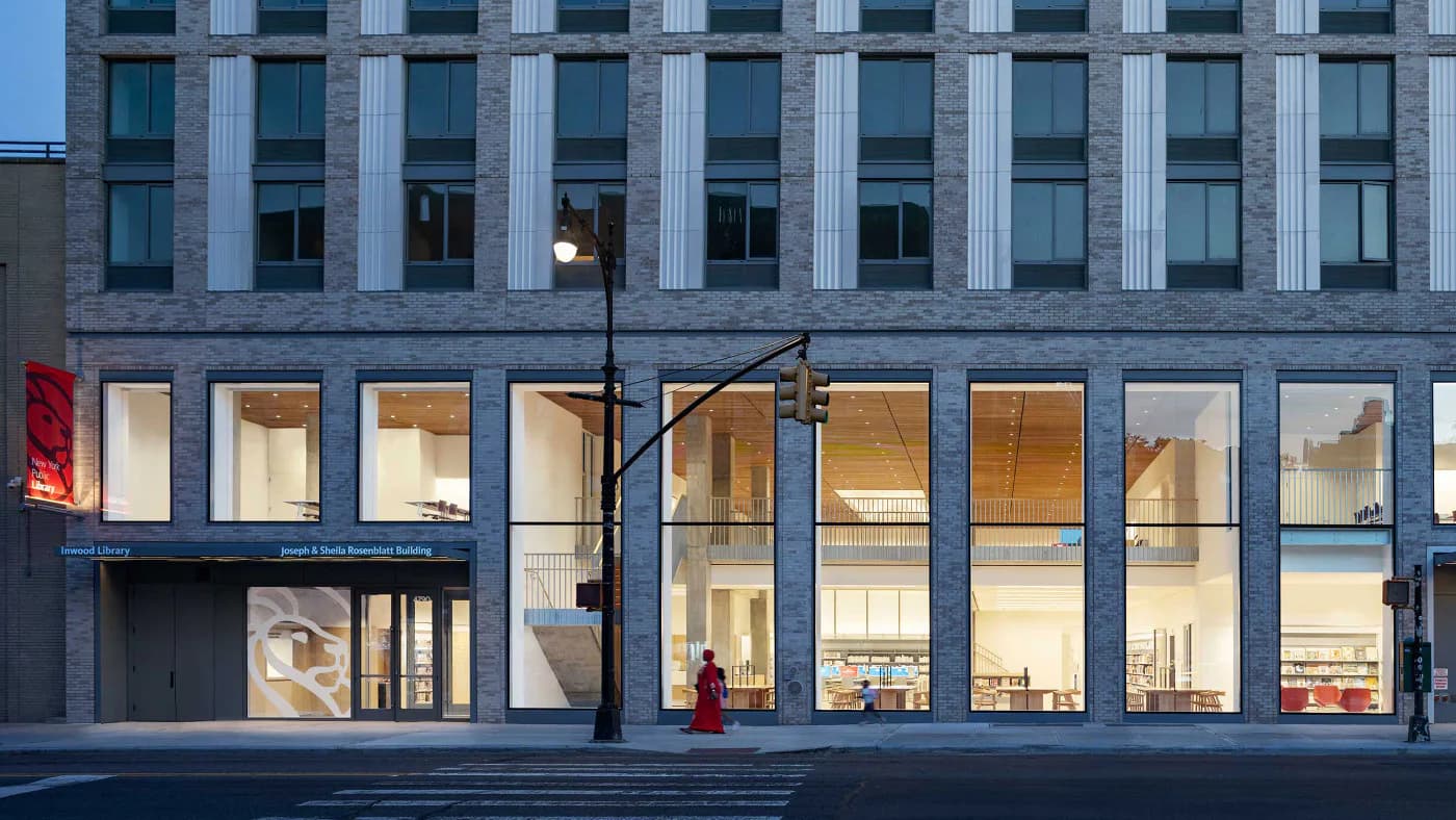 Ground floor retail storefront with expansive glazing, warm interior lighting, and minimalist modern aesthetic by Nina Jakic.