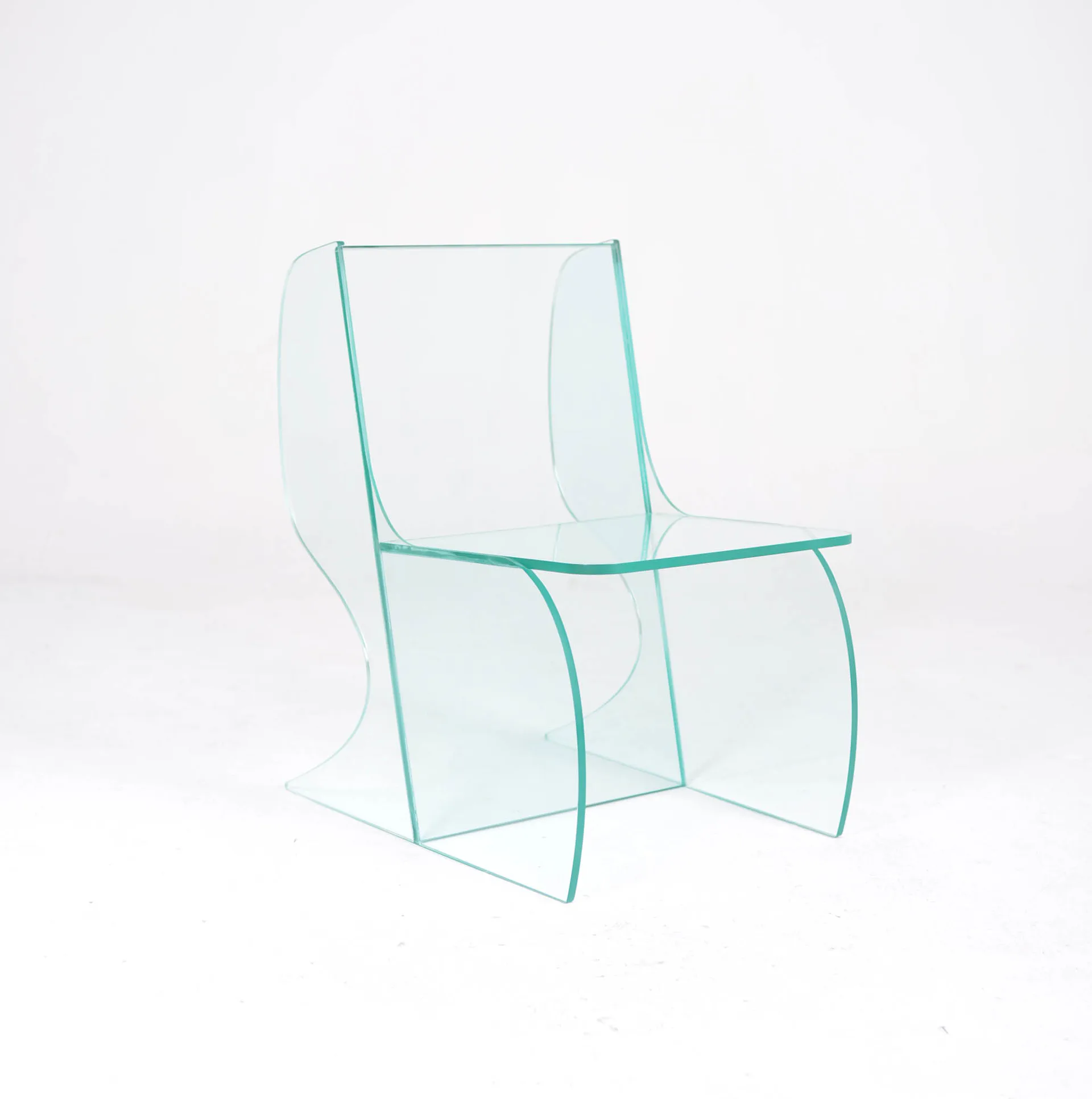 Transparent turquoise glass chair with curved geometric forms and linear frame details by Oliver Sheu.