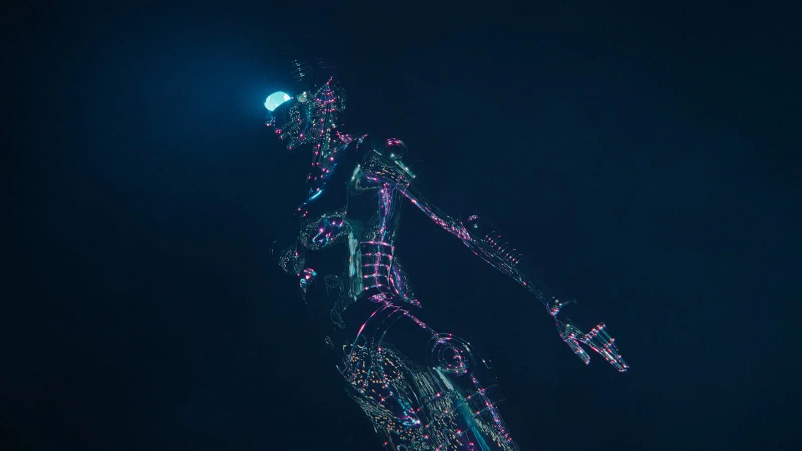 Aerial nighttime rendering of an illuminated urban masterplan with clustered buildings and glowing pathways against dark water, by Polina Zakh.