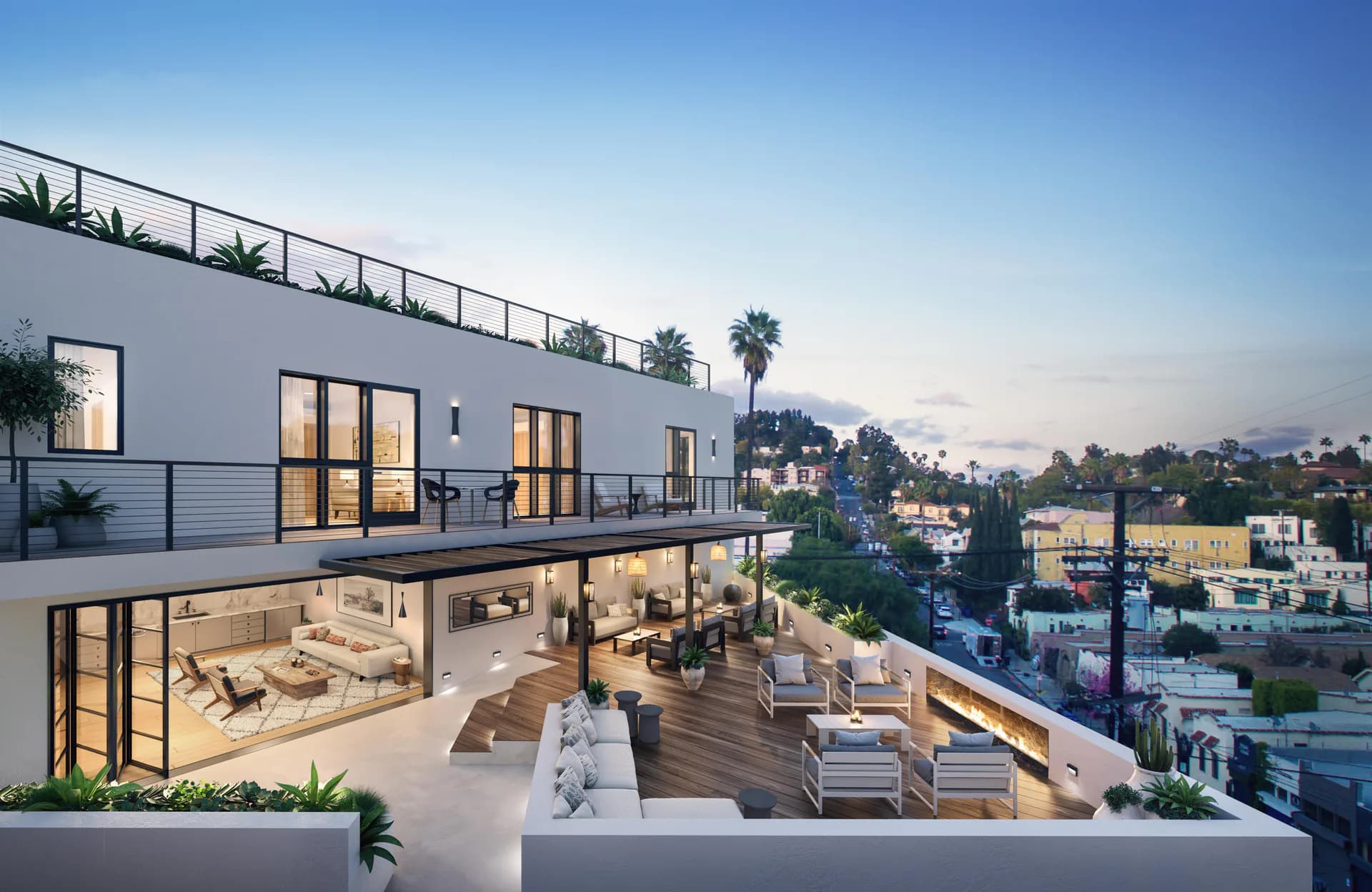 Modern multi-level residential architecture with extensive glazing, wooden deck terrace, and illuminated interiors at dusk by Rachel Robarge.