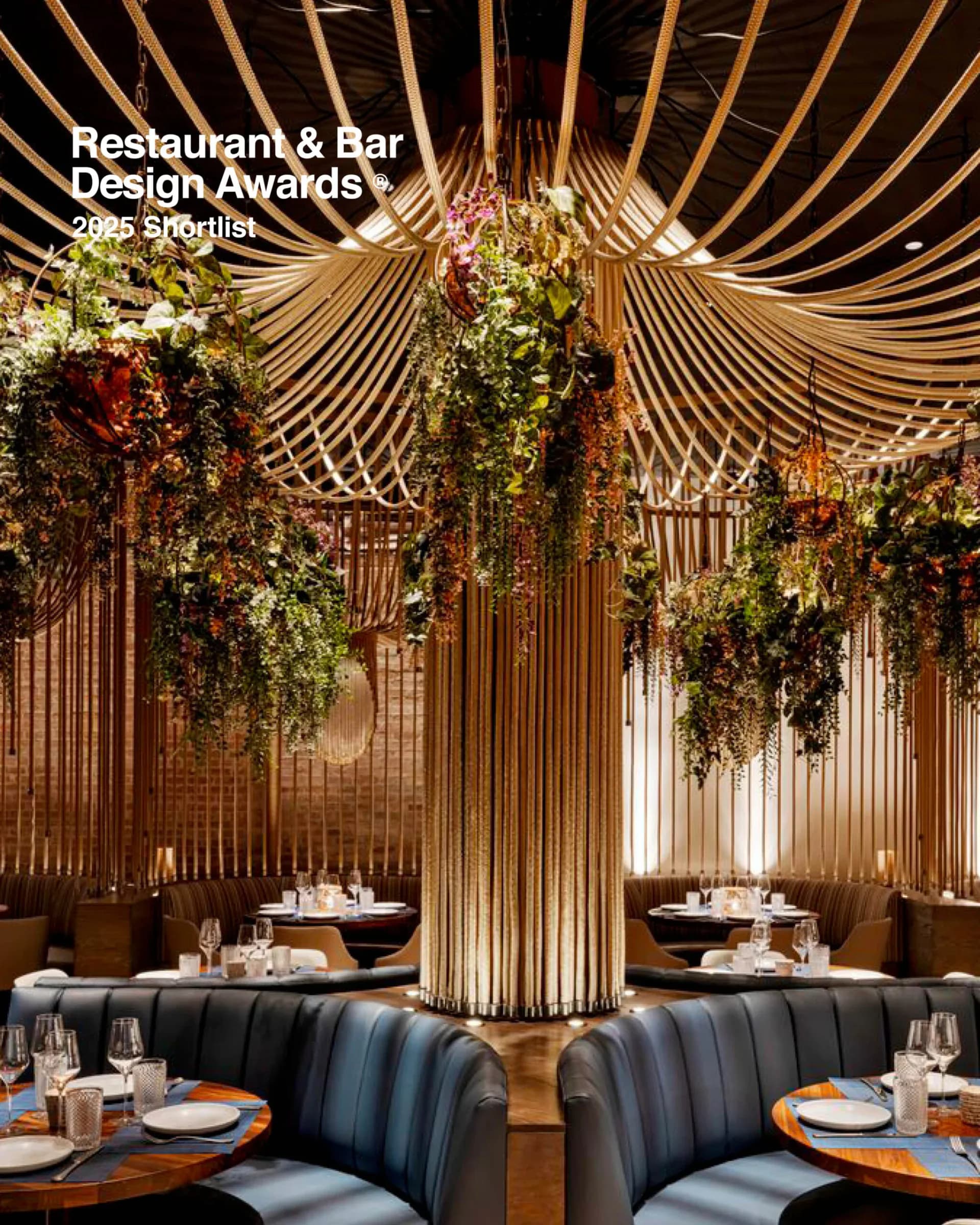 Fine dining restaurant interior featuring dramatic wooden ceiling structure with cascading greenery, curved black banquettes, warm lighting, and geometric wood slat architectural details by Salvador Juarez.