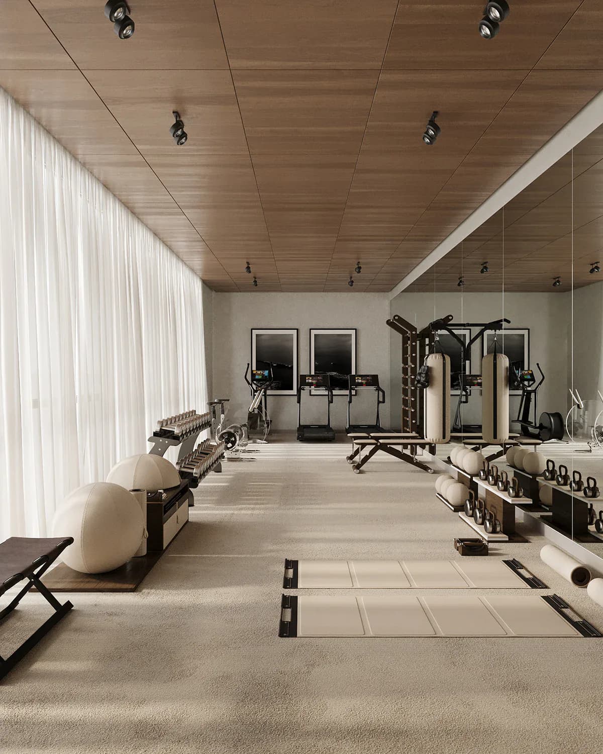 Modern home gym with wooden ceiling, light stone flooring, exercise equipment, and mirrored wall by Sam Kimball.
