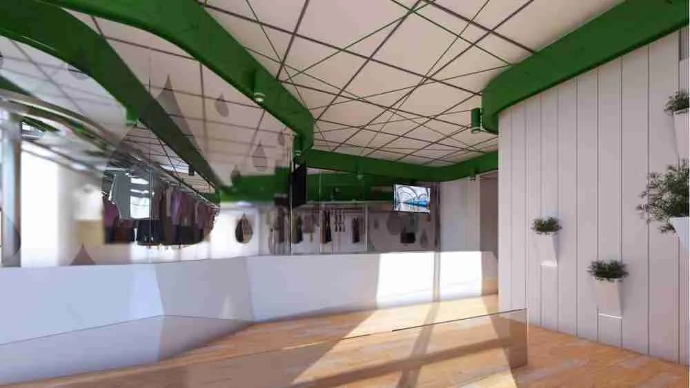 Modern retail or showroom interior with green beam ceiling, white walls, wooden flooring, and natural light streaming through skylights, designed by Bassel Shihab.
