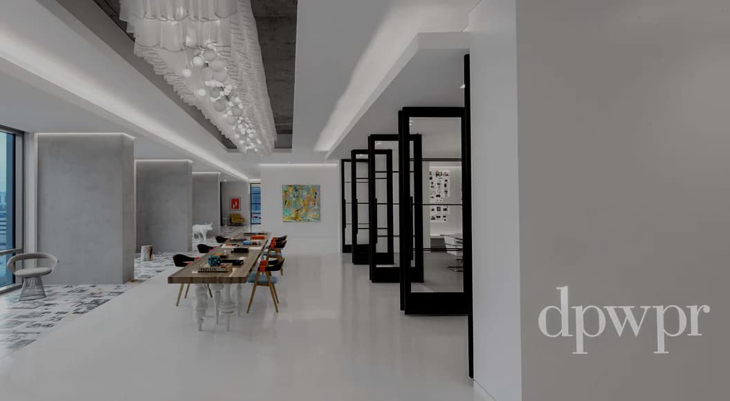 Modern white minimalist office interior with linear ceiling lights, natural wood dining table, geometric black room dividers, and clean palette by Stephanie Gibson-Roberts.