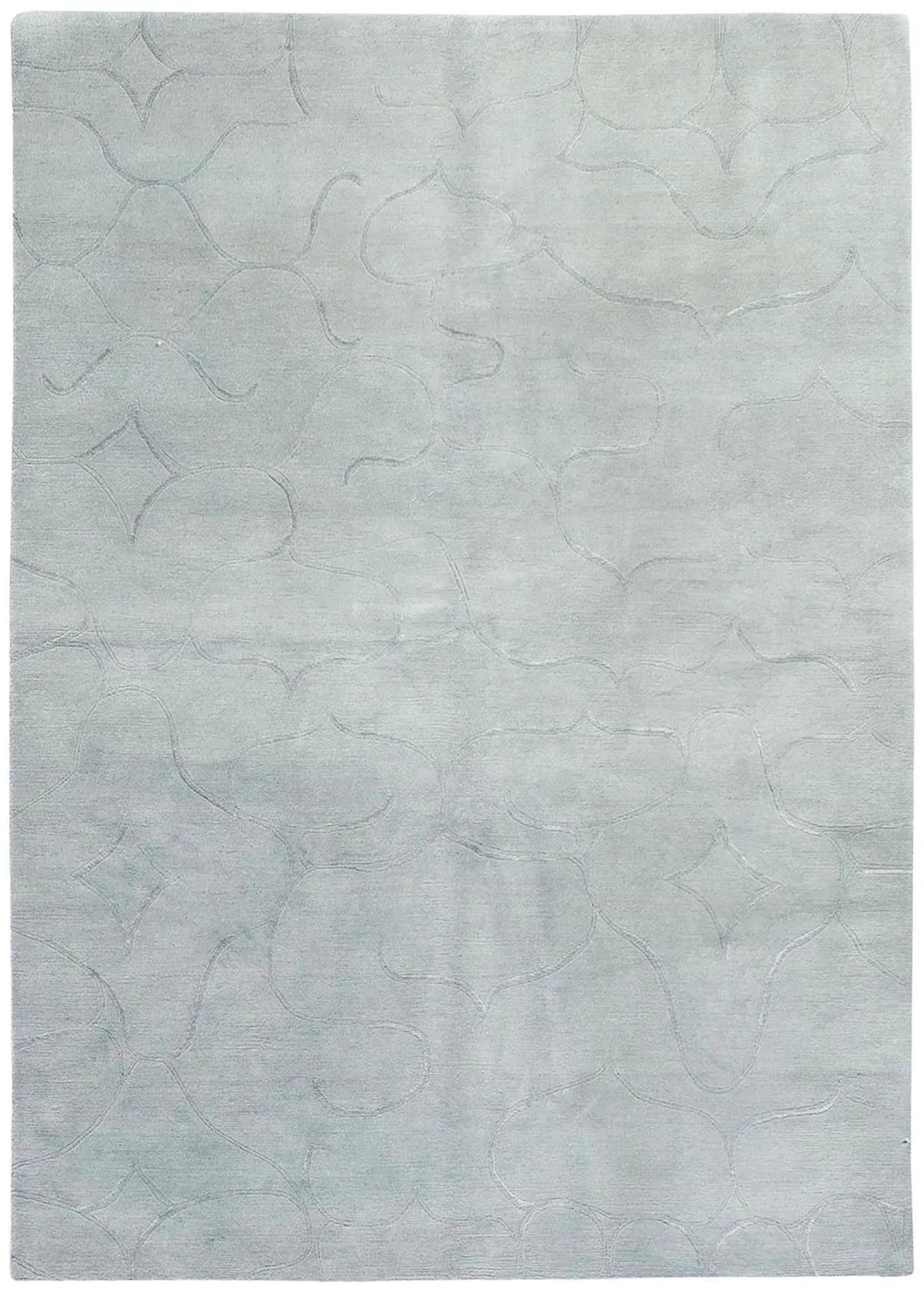 Soft gray area rug with subtle curvilinear pattern detail throughout, displayed flat to showcase texture and design by Stephanie Odegard.