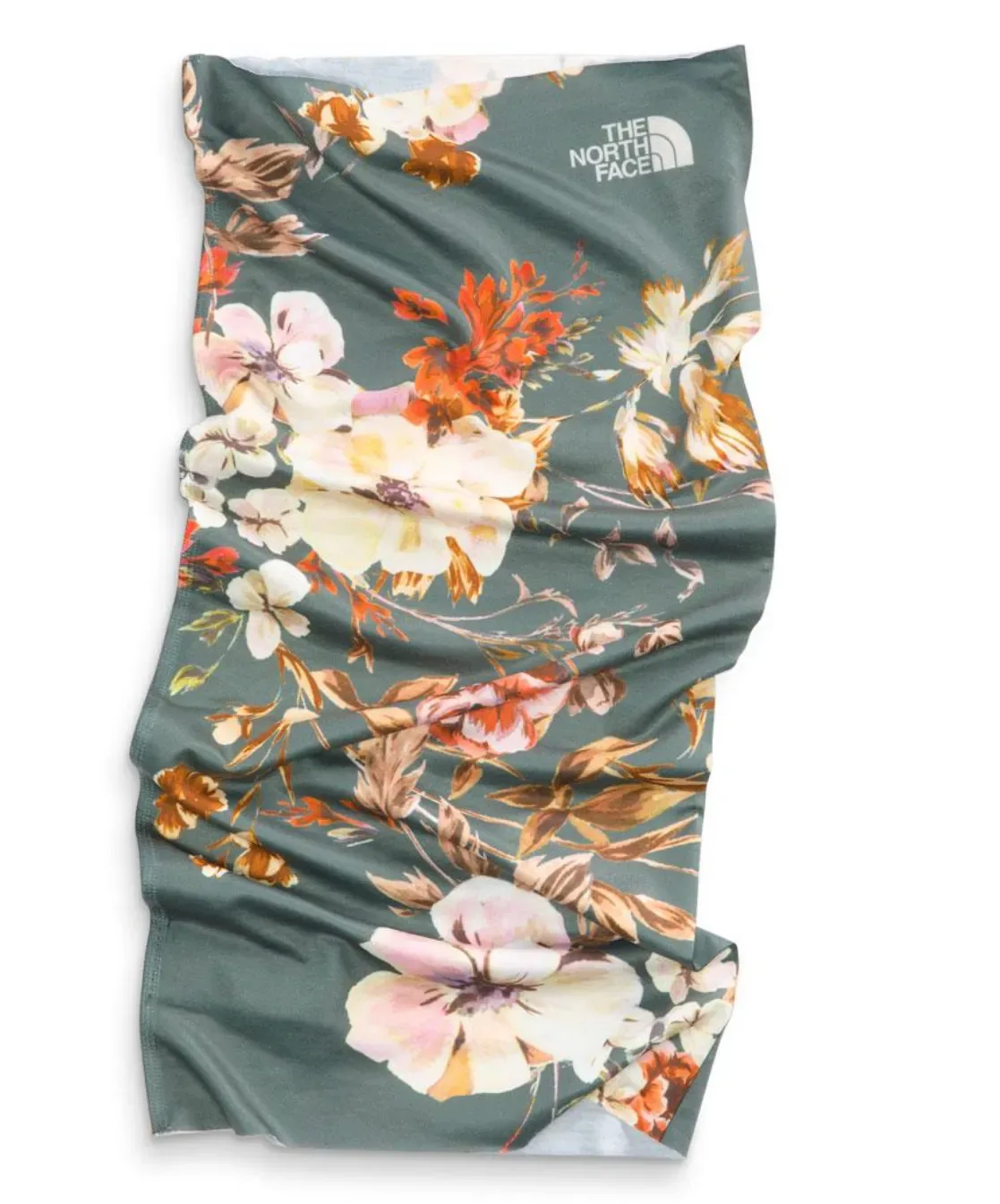 The North Face floral bandana featuring cream, pink, and orange botanical prints on a sage green base, styled flat lay by Stephanie Ogé.