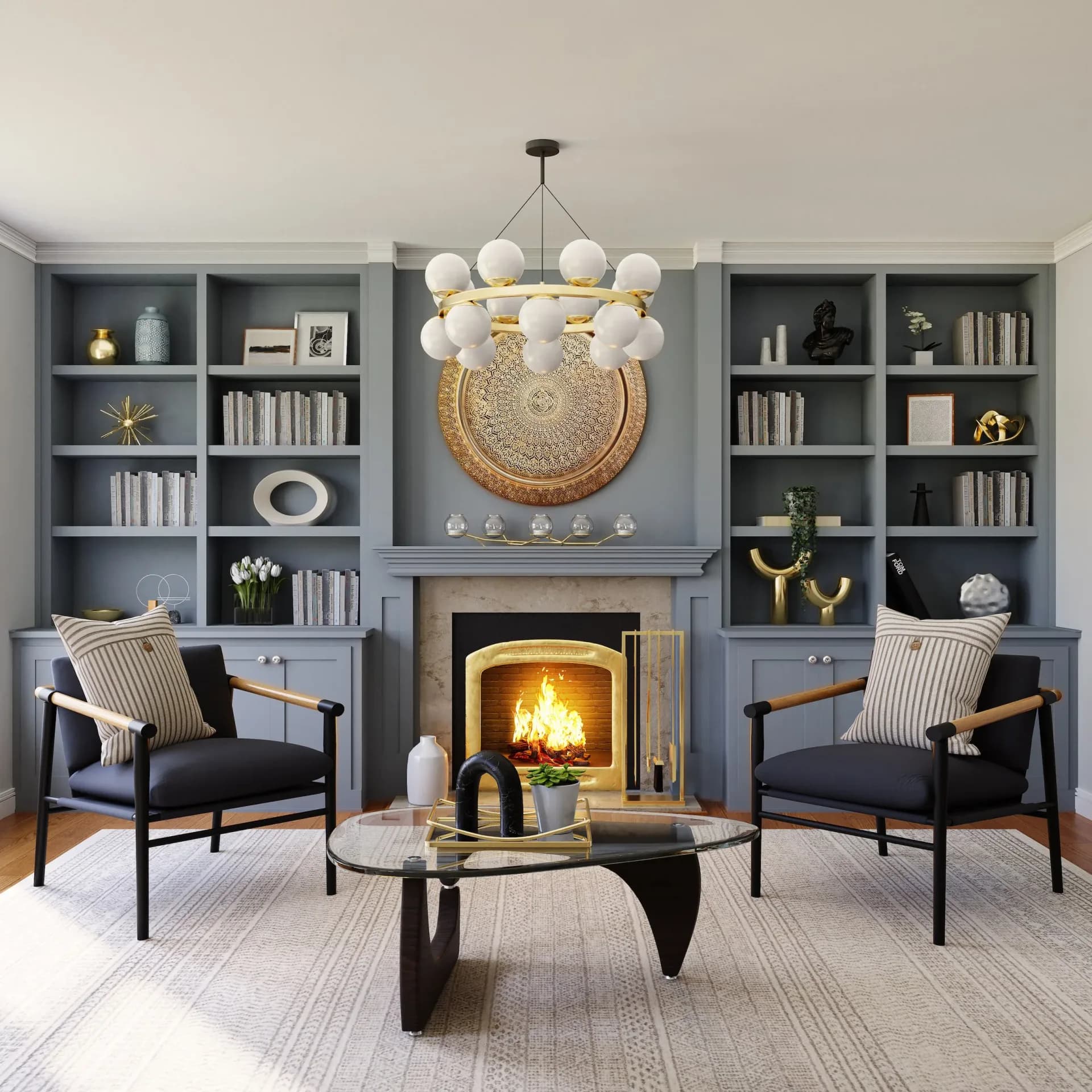 Contemporary living room with symmetrical built-in shelving, fireplace with glowing insert, pendant chandelier, and patterned area rug by Terry Sachs.