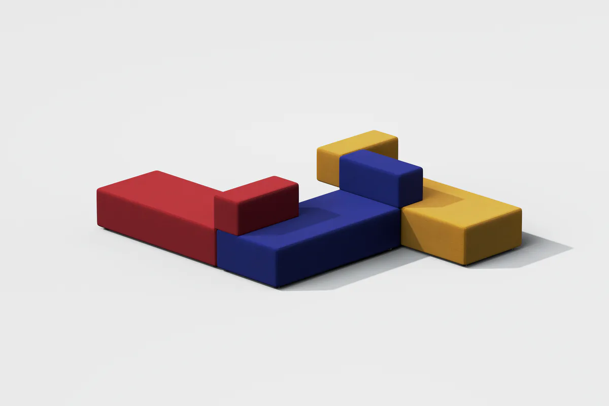 Abstract composition of stacked geometric blocks in red, blue, and yellow with smooth surfaces and soft shadows by Todd Bracher.