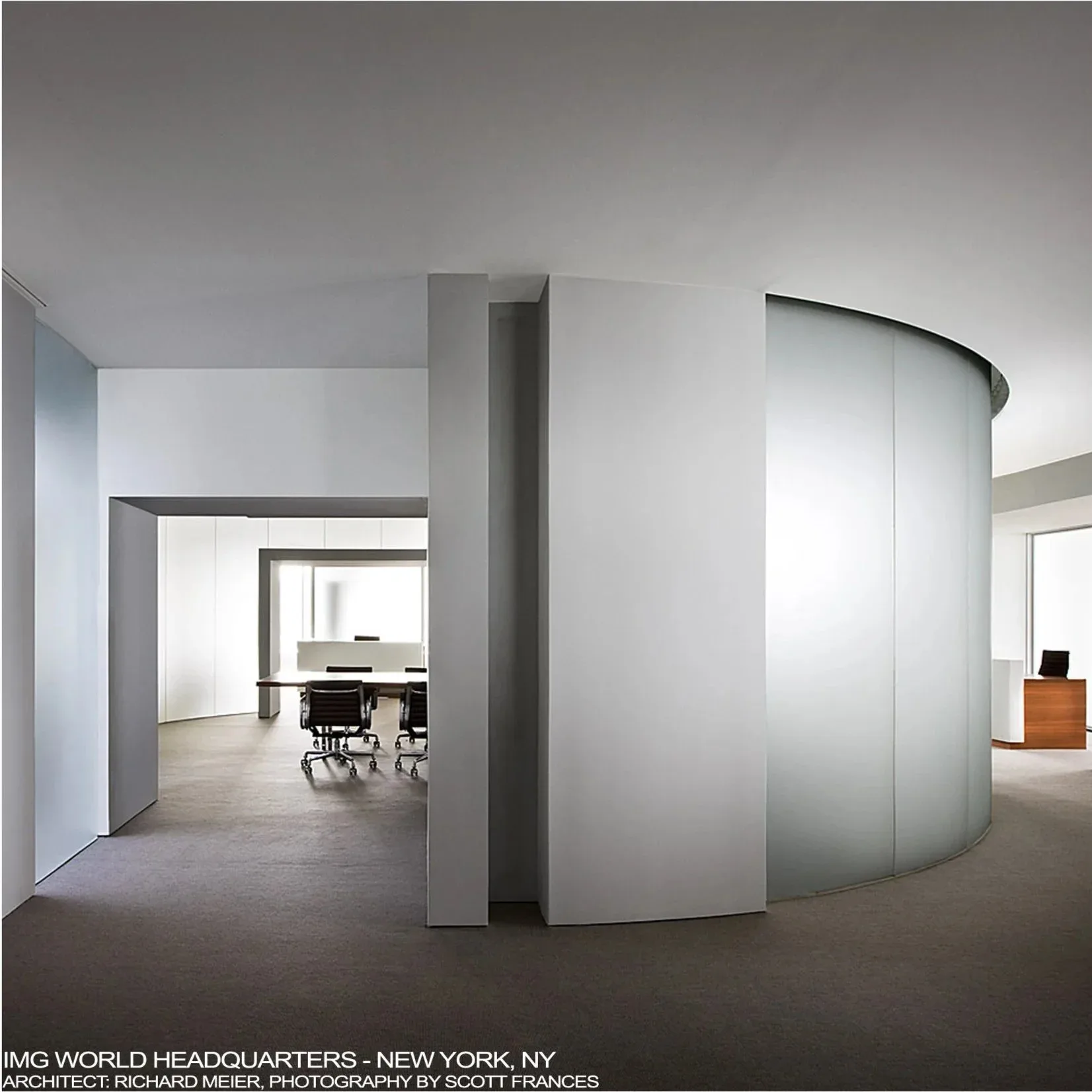 Minimalist office interior with curved frosted glass partitions and polished concrete flooring, featuring clean sightlines through translucent walls and modern sculptural spatial divisions by Tomas Dordevic.