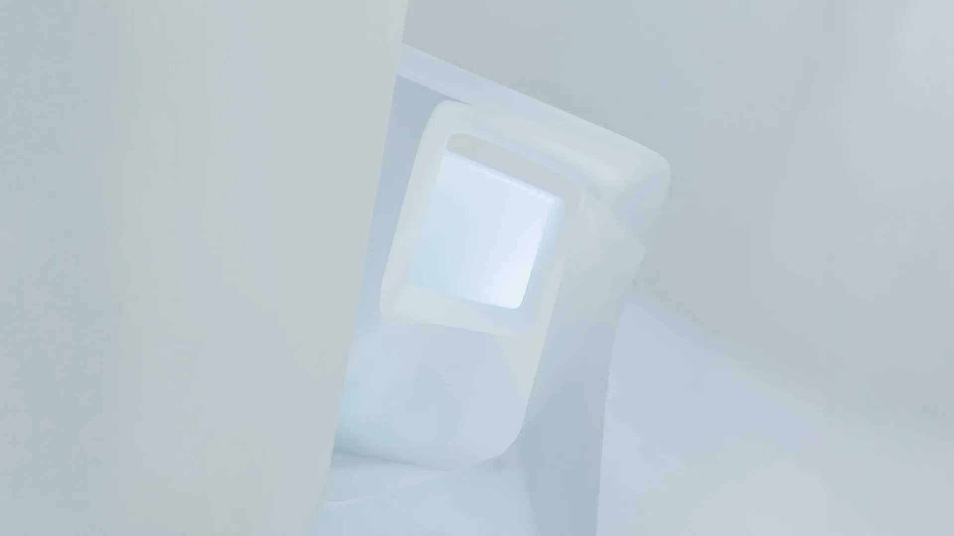 Abstract architectural rendering with soft white and blue tones showing geometric forms and ethereal spatial composition by Trevor Wood.