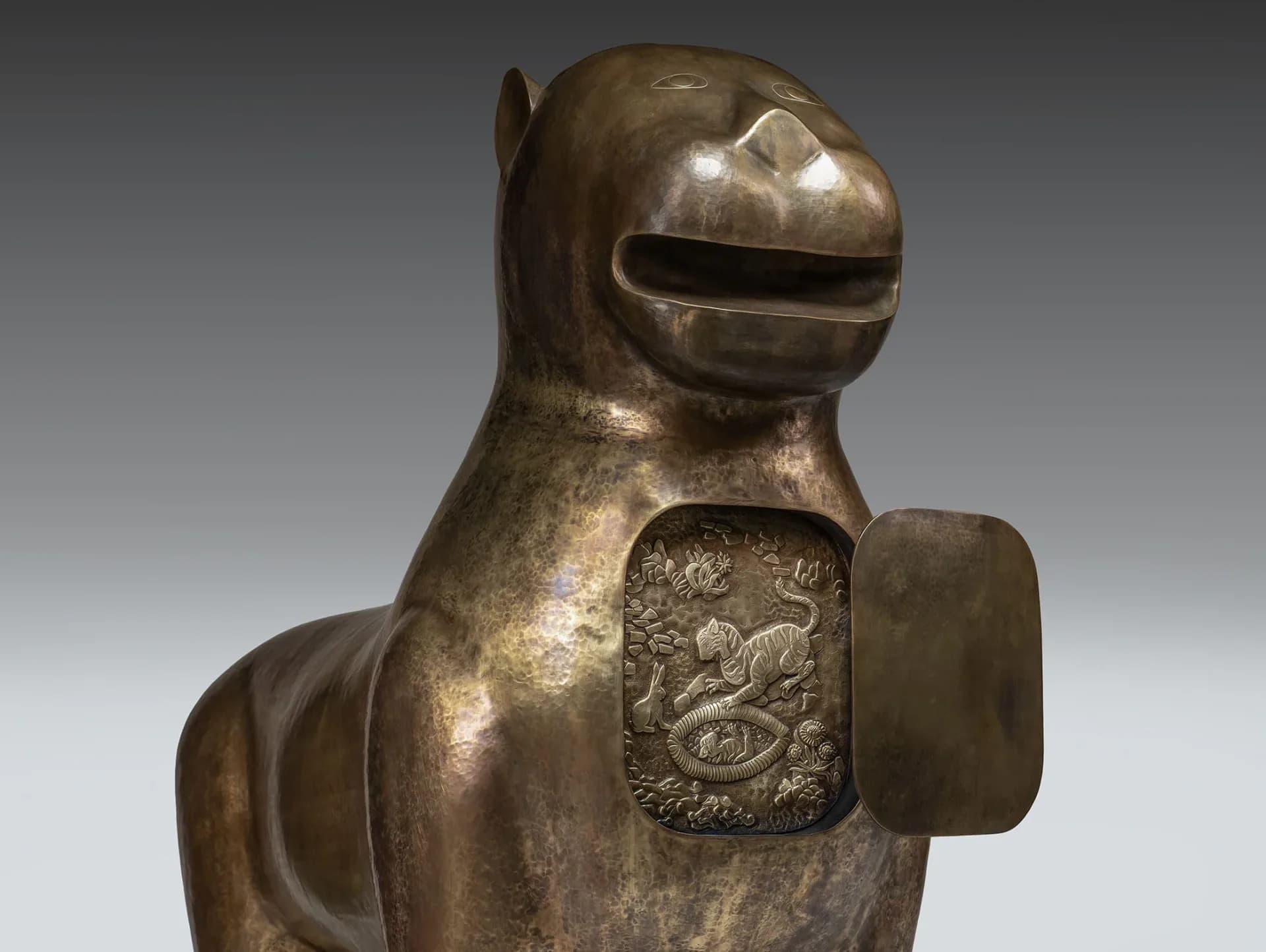 Bronze sculptural horse with decorative panel detail, polished metallic finish against neutral background, by Vikram Goyal.