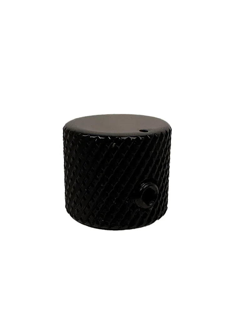 Black knurled cylindrical knob or hardware component with textured surface and polished top, product design by Vinny Fodera.